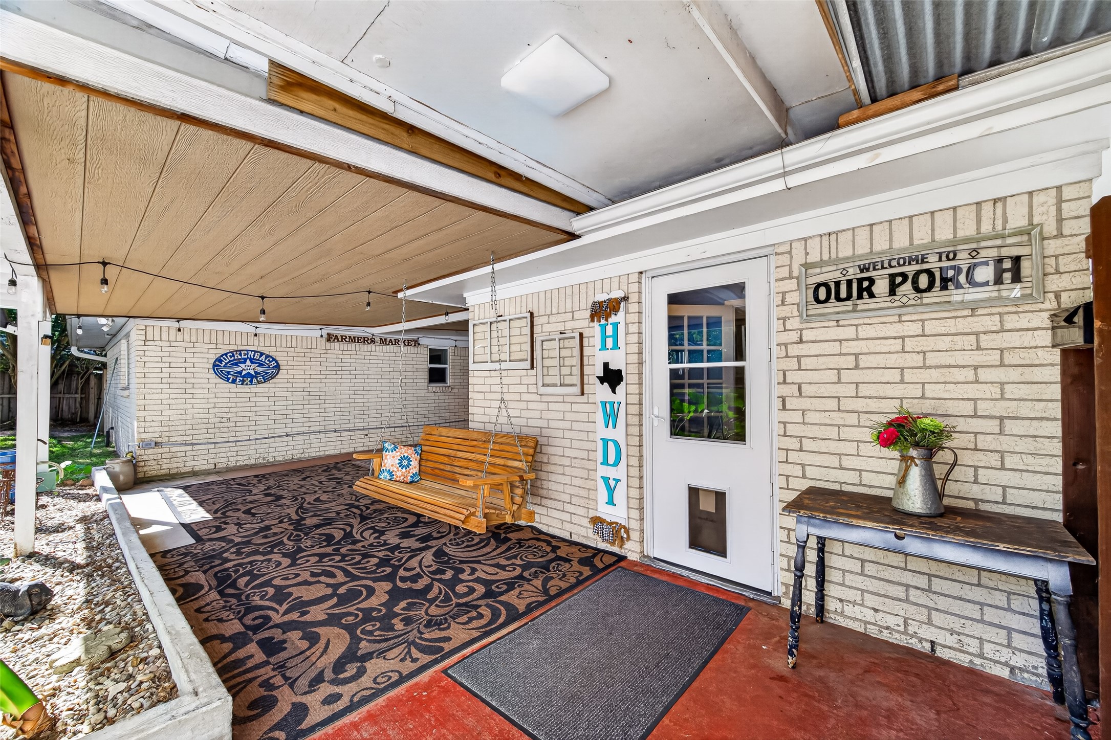 OUTSIDE IN THE BACKYARD YOU WILL FIND A WONDERFUL AND SPACIOUS BACK PORCH. RECENT UPDATES INCLUDE ADDED INSTALLATION AND ALONG WITH A WOOD CEILING AND EXTENDED ROCK GARDEN. THE MOUNTED TV, OUTDOOR RUGS AND HANGING LIGHTS WILL REMAIN WITH THE HOME. (EXCLUSION INCLUDE THE PORCH SWING, DECOR AND SIGNS)