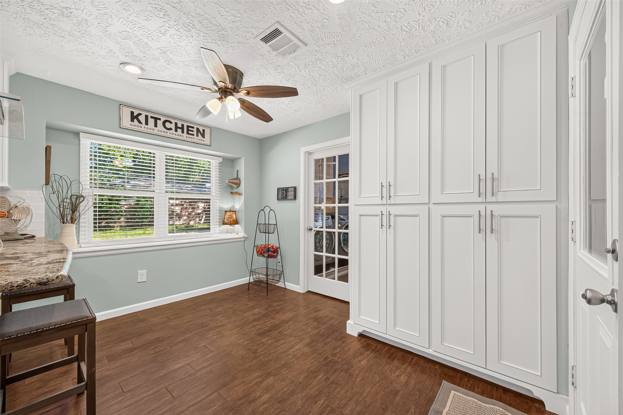 SPACIOUS PANTRY WITH DRAWERS THAT SLIDE OUT FOR YOUR CAN GOODS; GLASS DOOR LEADS INTO THE LAUNDRY ROOM AND A DOOR TO THE PATIO; SPACIOUS BREAKFAST ROOM WITH LOTS OF NATURAL LIGHT