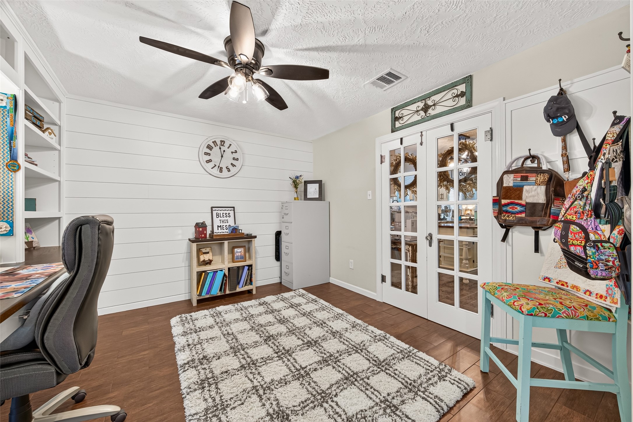 THE CUSTOM CORNER WAS MADE FOR HANGING ITEMS ON, ADDED A SHIPLAP ACCENT WALL, BEAUTIFUL TILE FLOORS AND THE VINTAGE DOUBLE GLASS DOORS WERE MY GRANDMOTHERS (IN HER HOME); I HAD THEM REFURBISHED AND INSTALLED; ALL ORIGINAL HARDWARD TO THE DOOR AND THE GLASS DOOR KNOW; ADDED A CEILING FAN