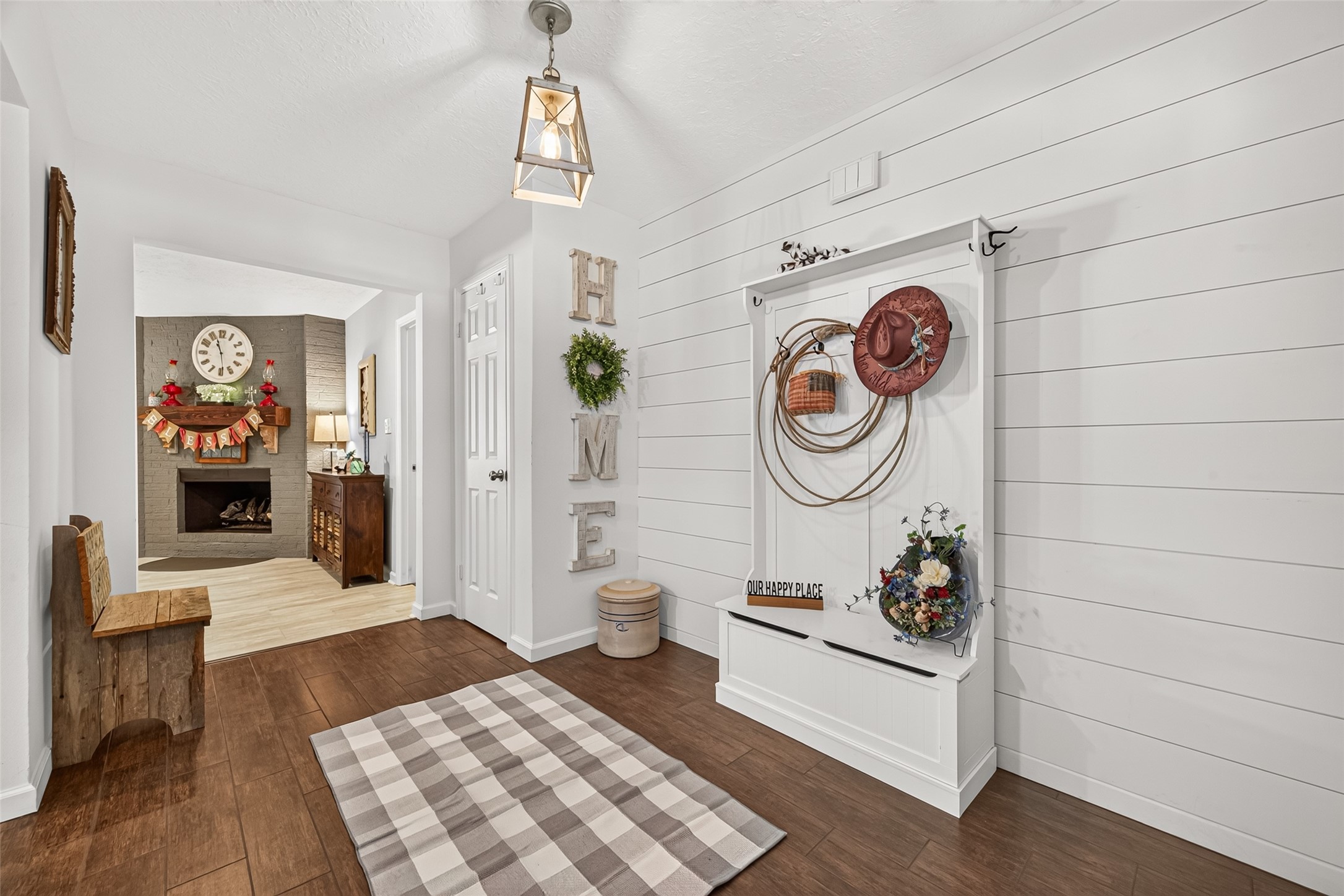 LOOK HOW BIG THE FRONT ENTRYWAY IS FOR YOUR TO DECORATE AND WELCOME YOUR FAMILY AND GUEST AS THEY WALK THRU THE FRONT DOOR. ADDED AN SHIPLAP ACCENT WALL AND A NEW LIGHT FIXTURE;