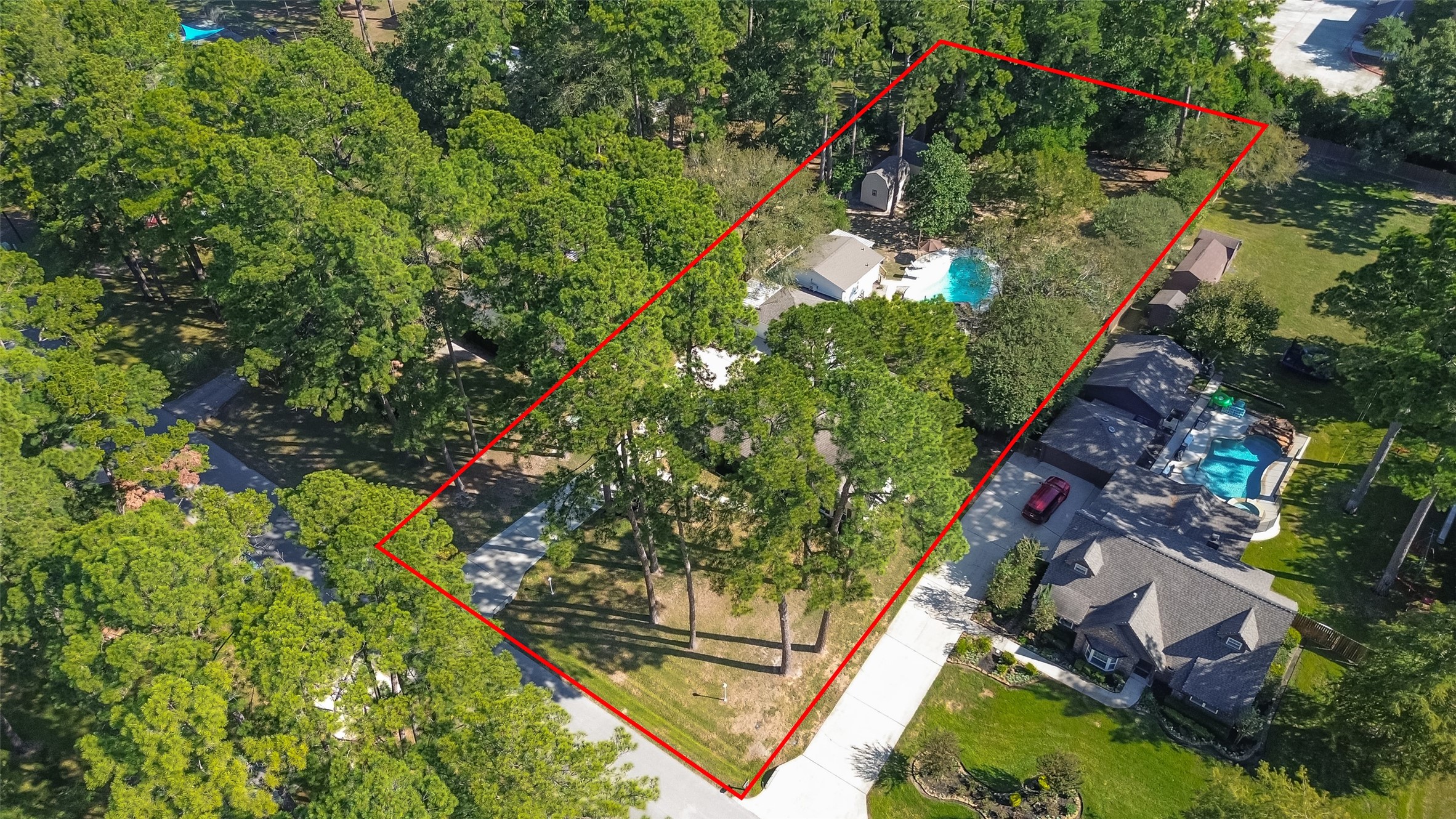 THE RED LINE IS SHOWING THE APPROXIMATELY BOUNDARY LINE AND SIZE OF THE PROPERTY. A SURVEY IS AVAILABLE.