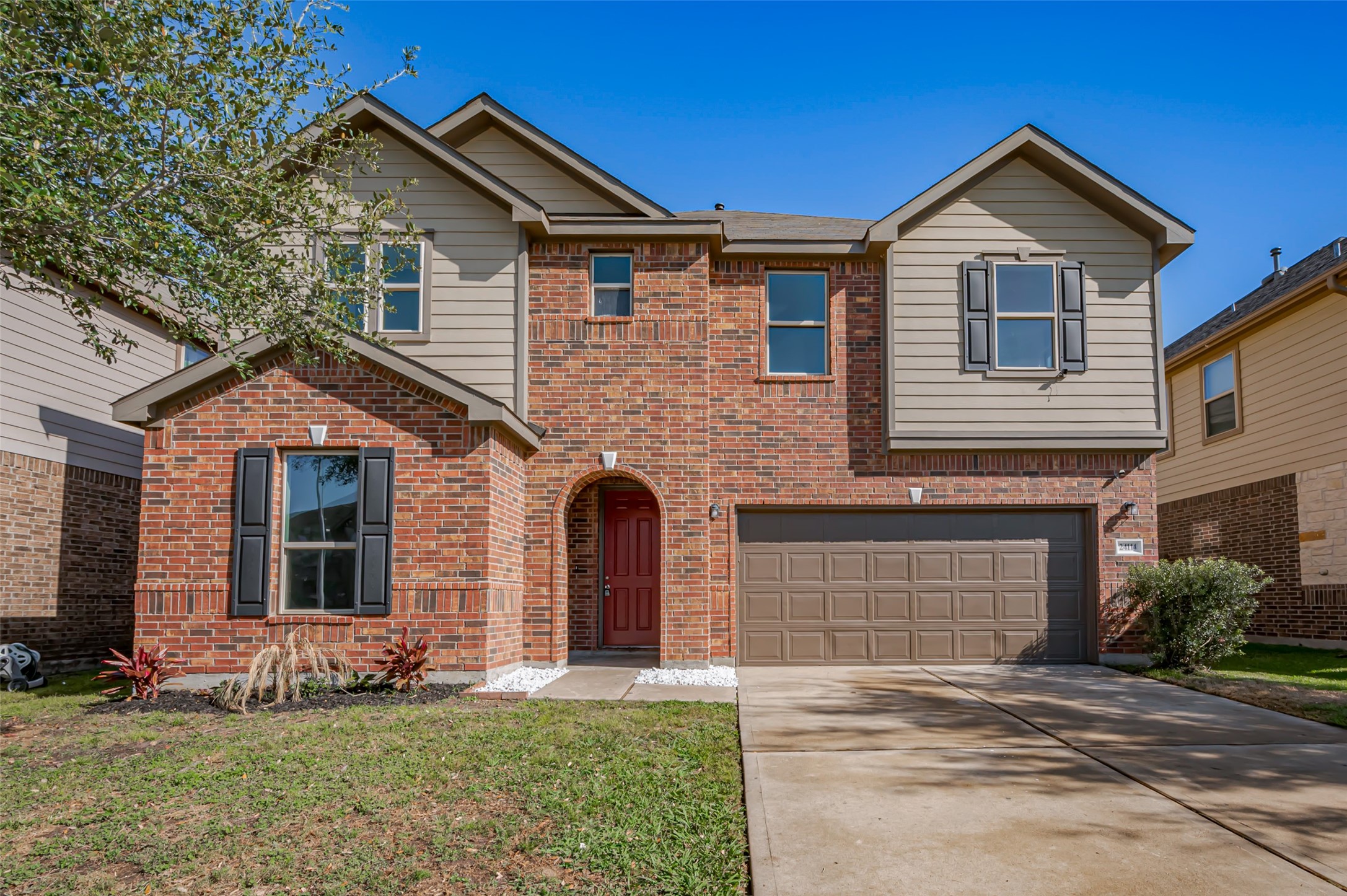 Two-story home with an attached two-car garage and a beautiful yard. Two-story home with an attached two-car garage and a beautiful yard.