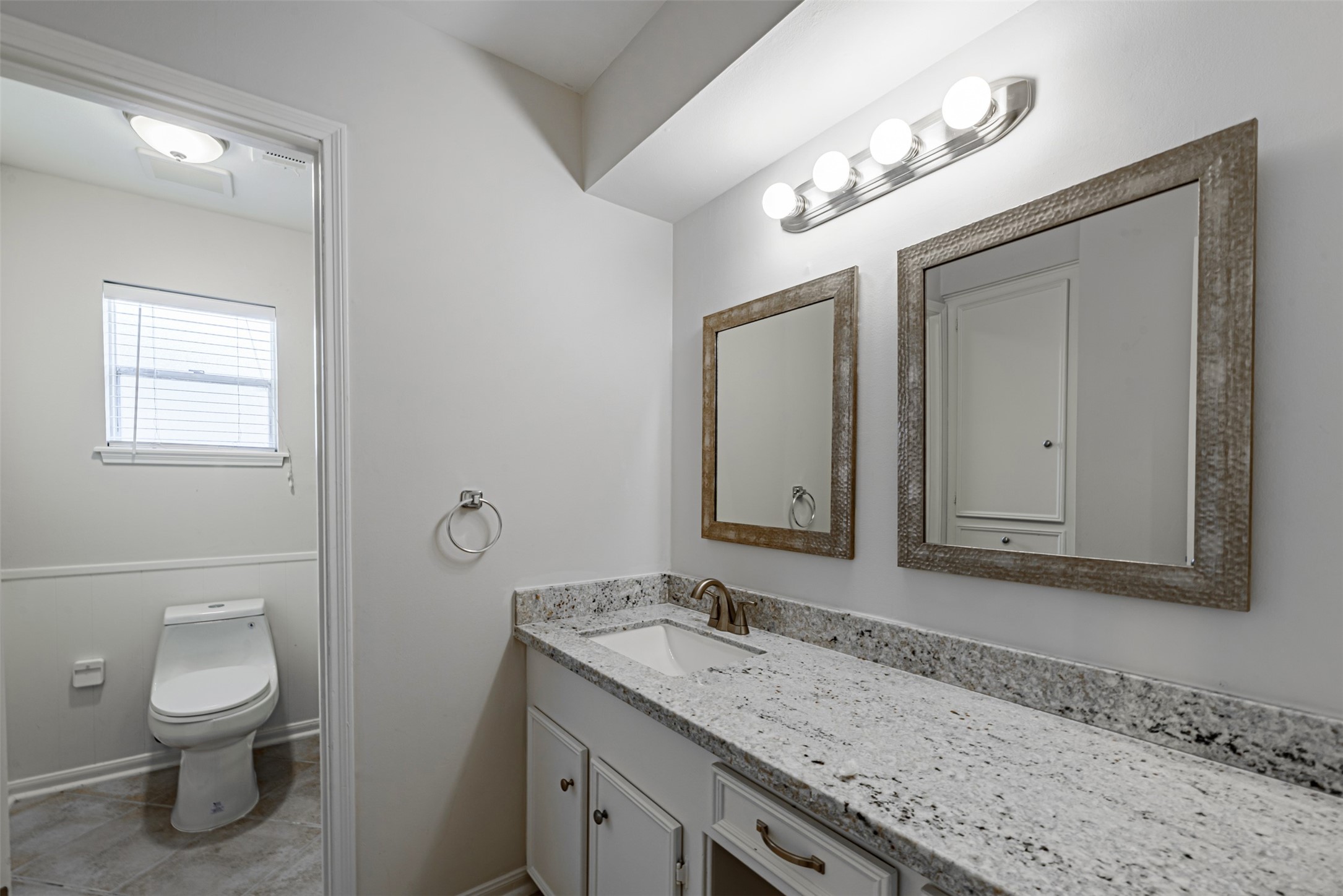 Very modern and clean remodeled bathroom and plenty of work space on the vanities.