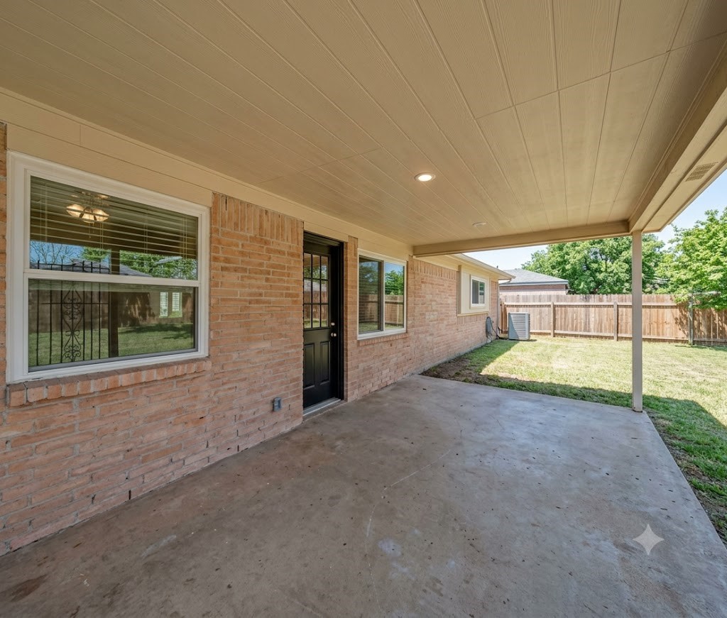 Enjoy outdoor living in style with this spacious covered patio, perfect for entertaining or relaxing in the shade.