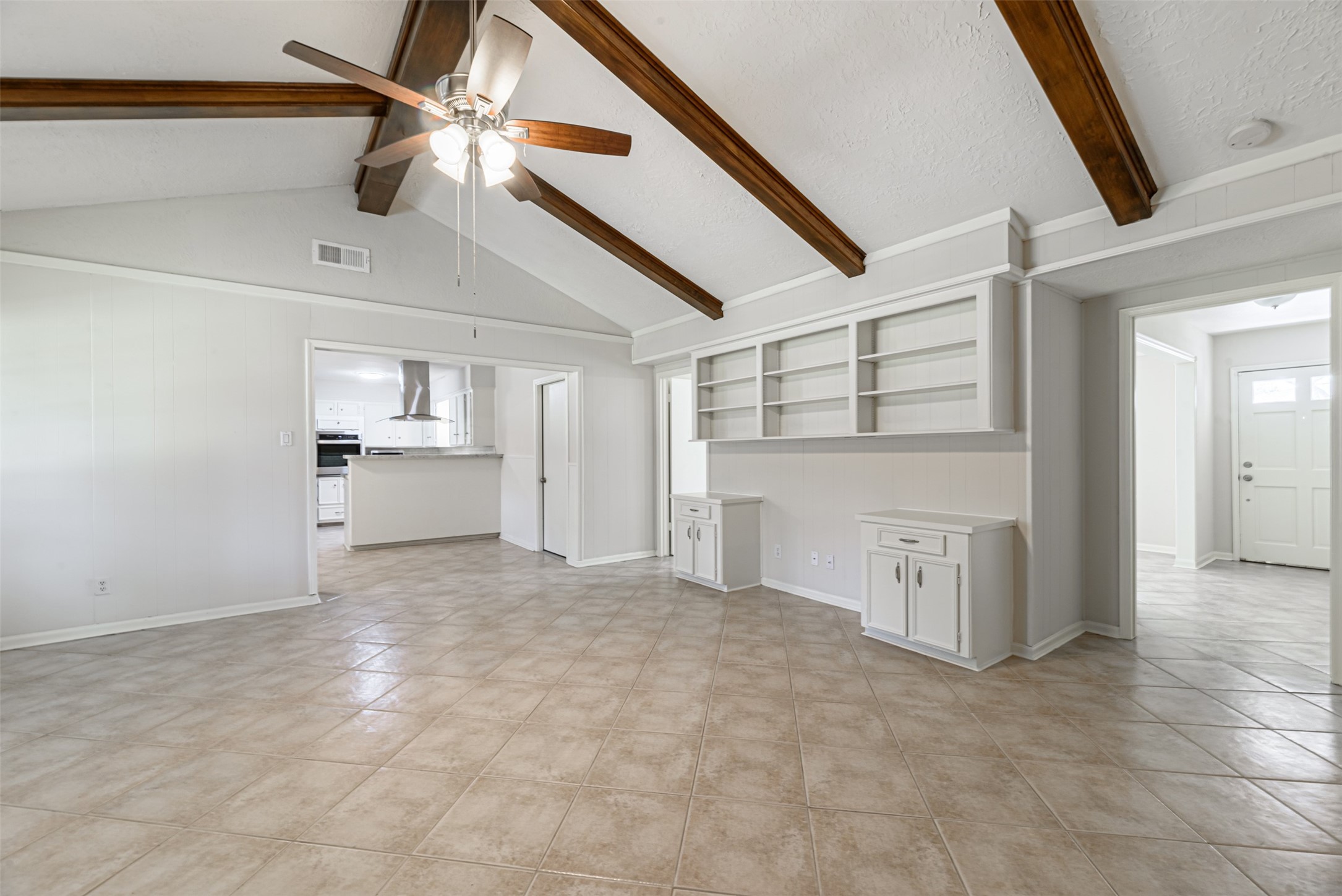 Discover the ideal space for your home office within this spacious family room, perfectly accommodating your desk and work needs.