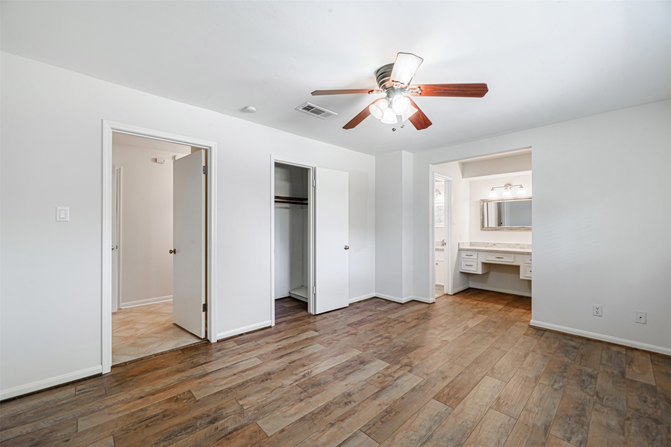 The master bedroom has a double closet and the separate vanity from the shower offers desirable privacy.