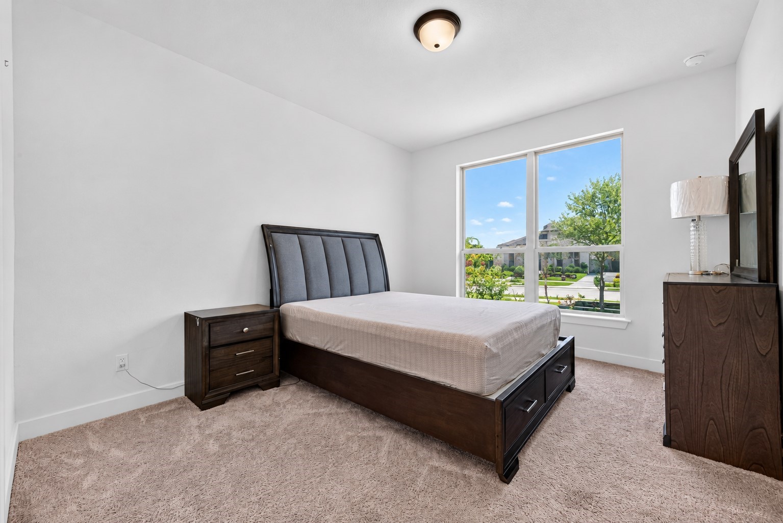 A beautifully appointed first-floor guest bedroom featuring a private en-suite bathroom, offering an elevated level of comfort, privacy, and convenience for visiting guests or multigenerational living