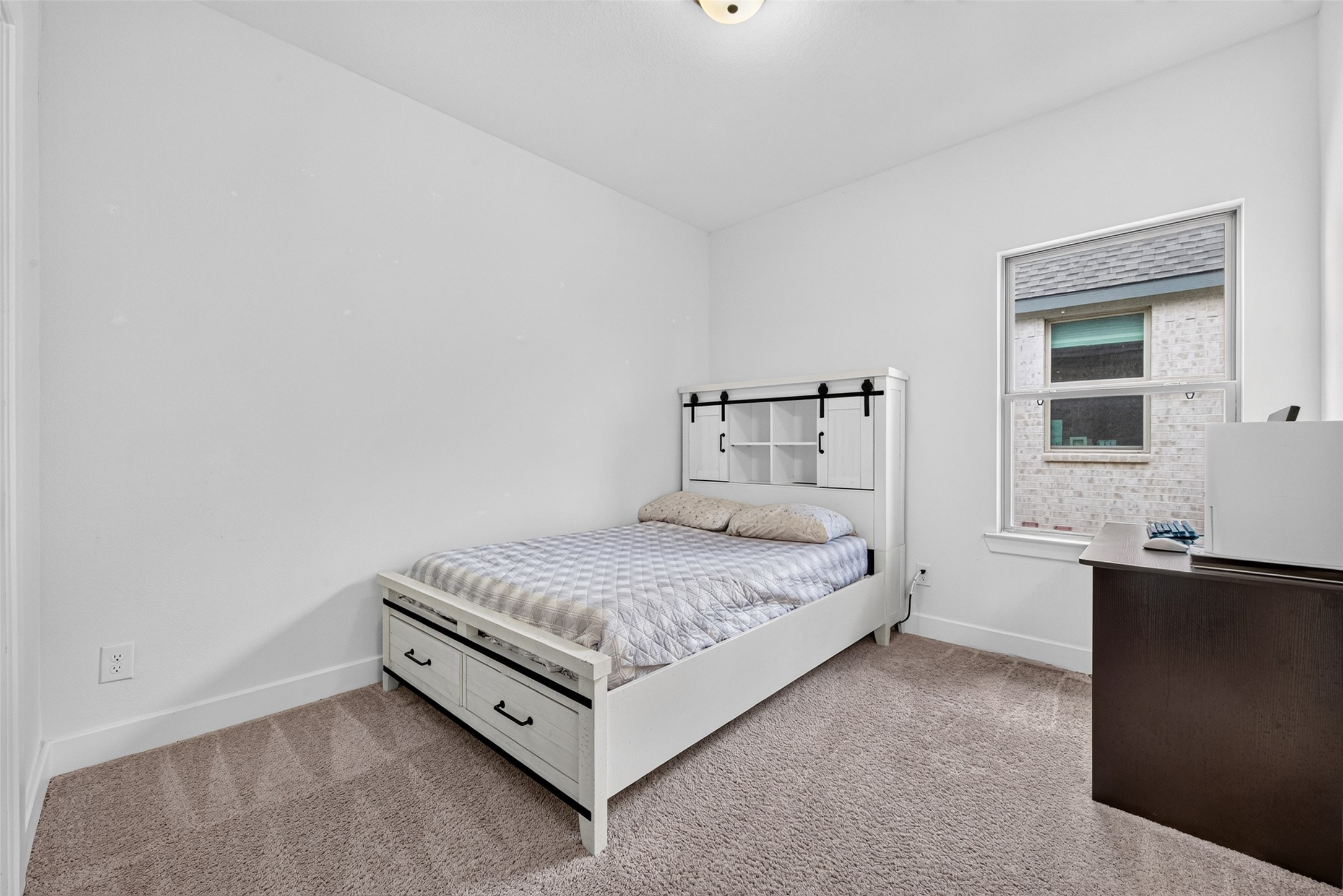 Second-floor Secondary Bedroom #1 offers a private and inviting retreat with convenient bathroom access, thoughtfully designed to provide comfort, flexibility, and a touch of everyday luxury