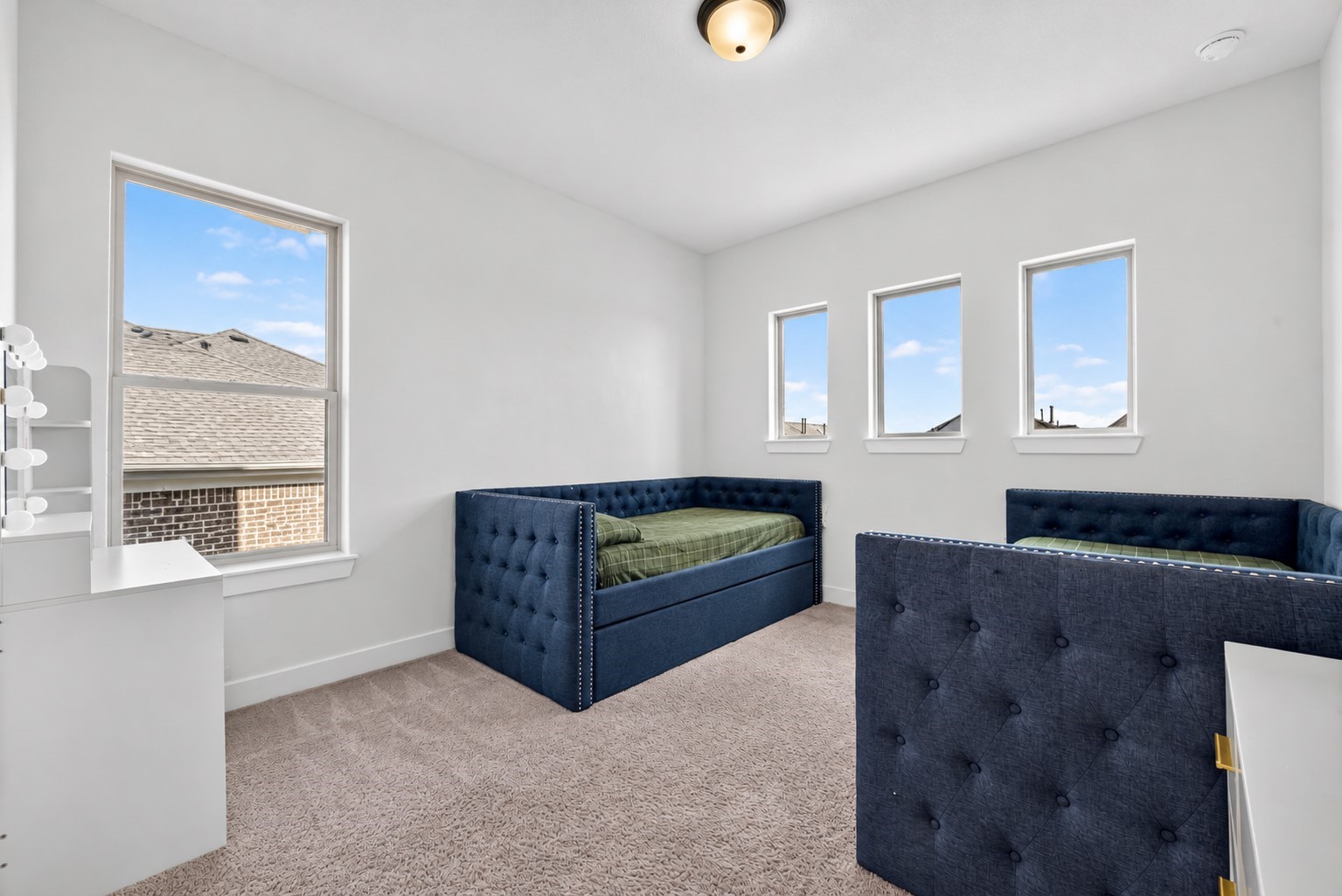 Second-floor Secondary Bedroom #2 offers a versatile and bright inviting space with convenient bathroom access, providing comfort and flexibility for everyday living