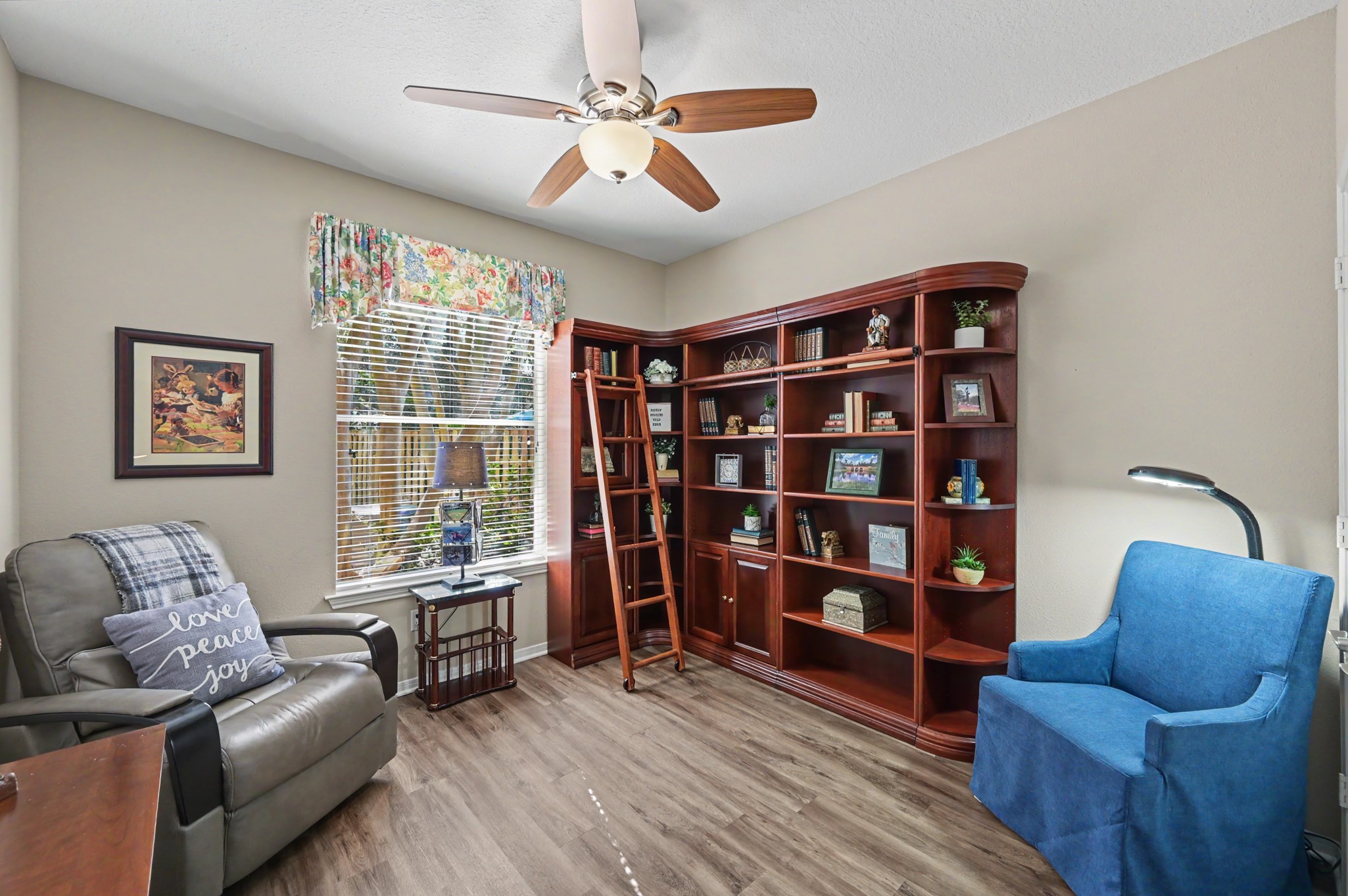 1st secondary bedrooms downstairs being used as a library/reading room