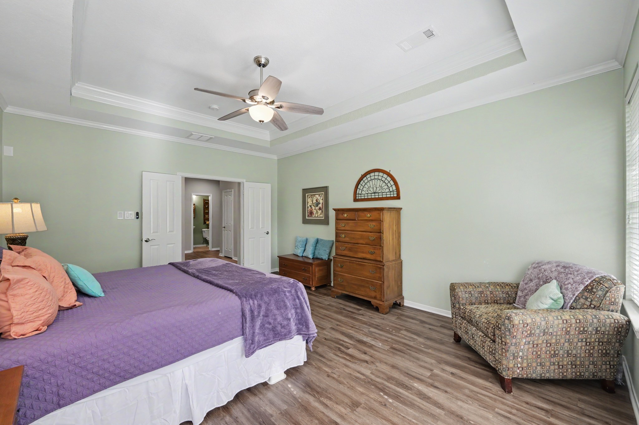 Primary bedroom with tray ceilings and lots of space