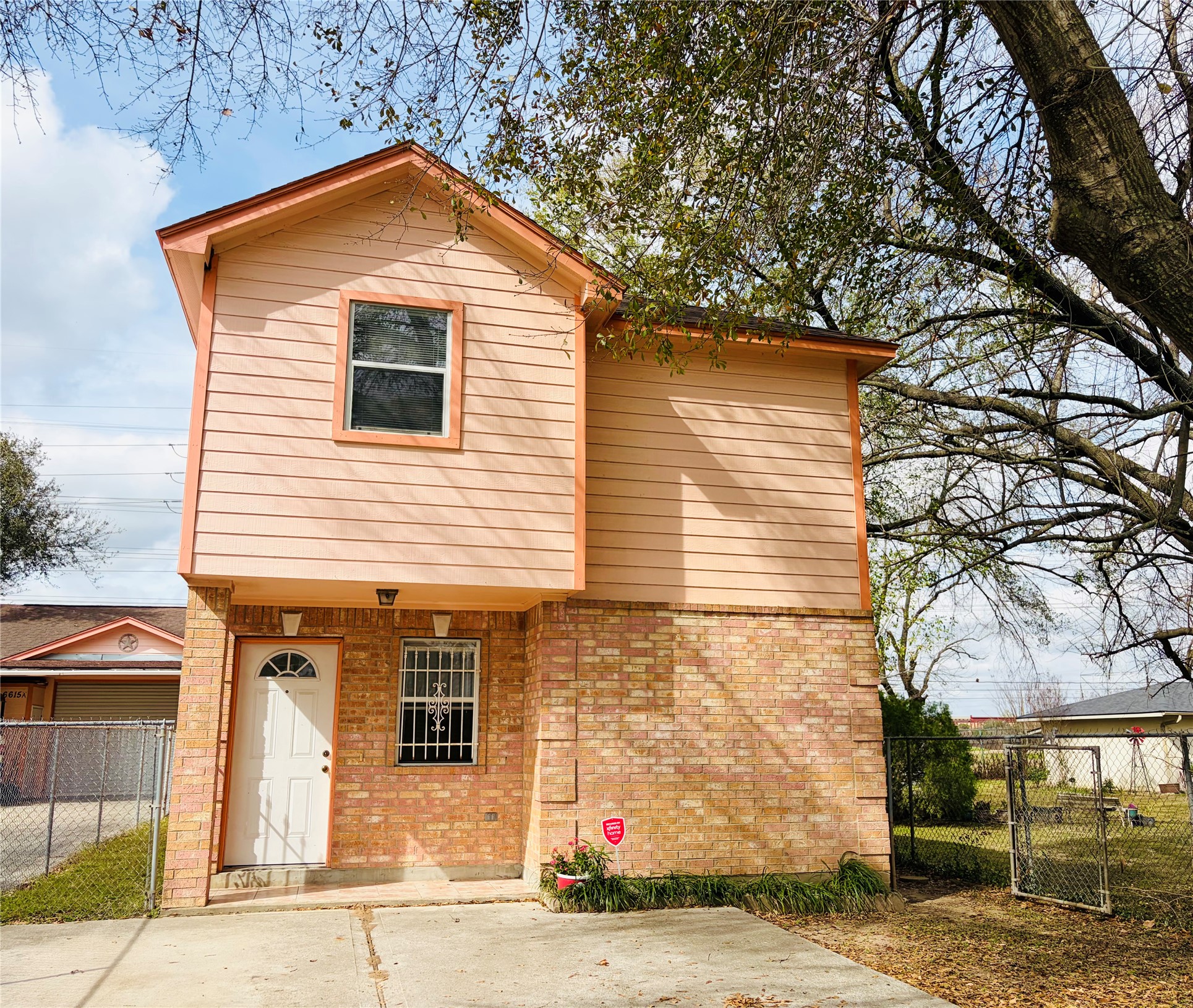 Charming two story with mature trees and plenty of parking space at front