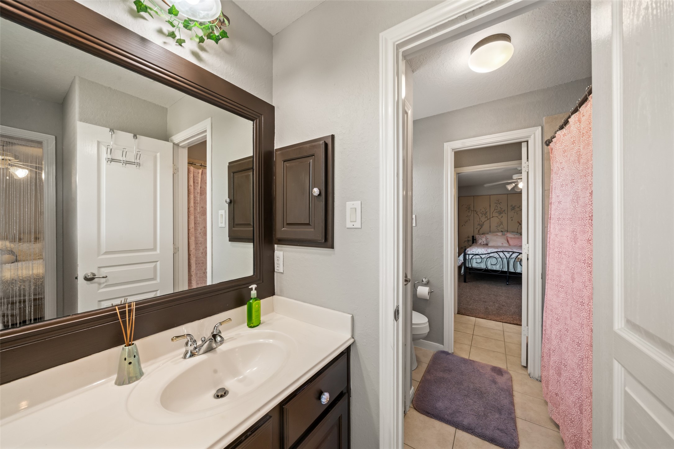 This upstairs shared bathroom has a vanity by each bedroom making getting ready routines easier.