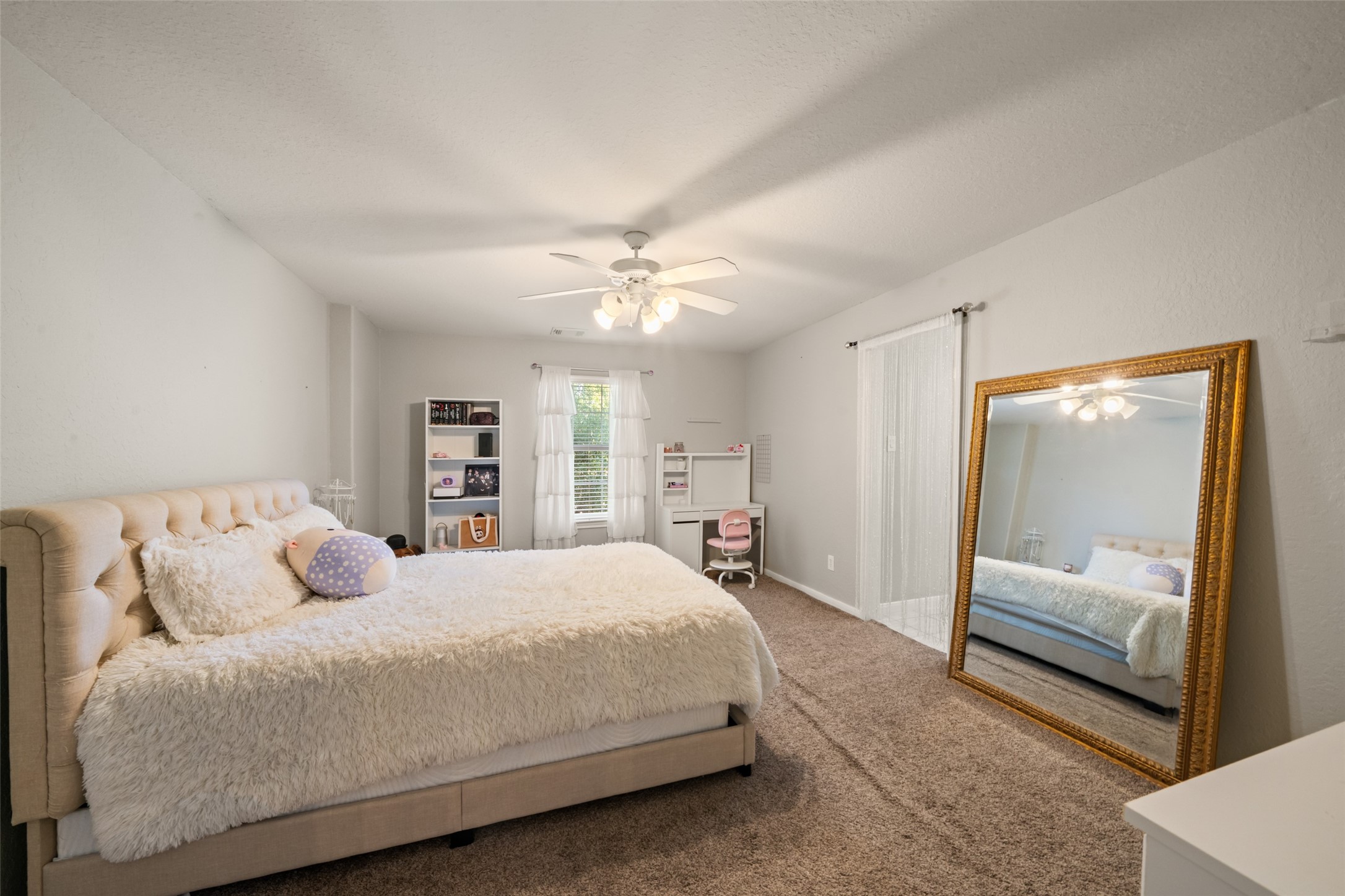 Still another large bedroom filled with natural light.