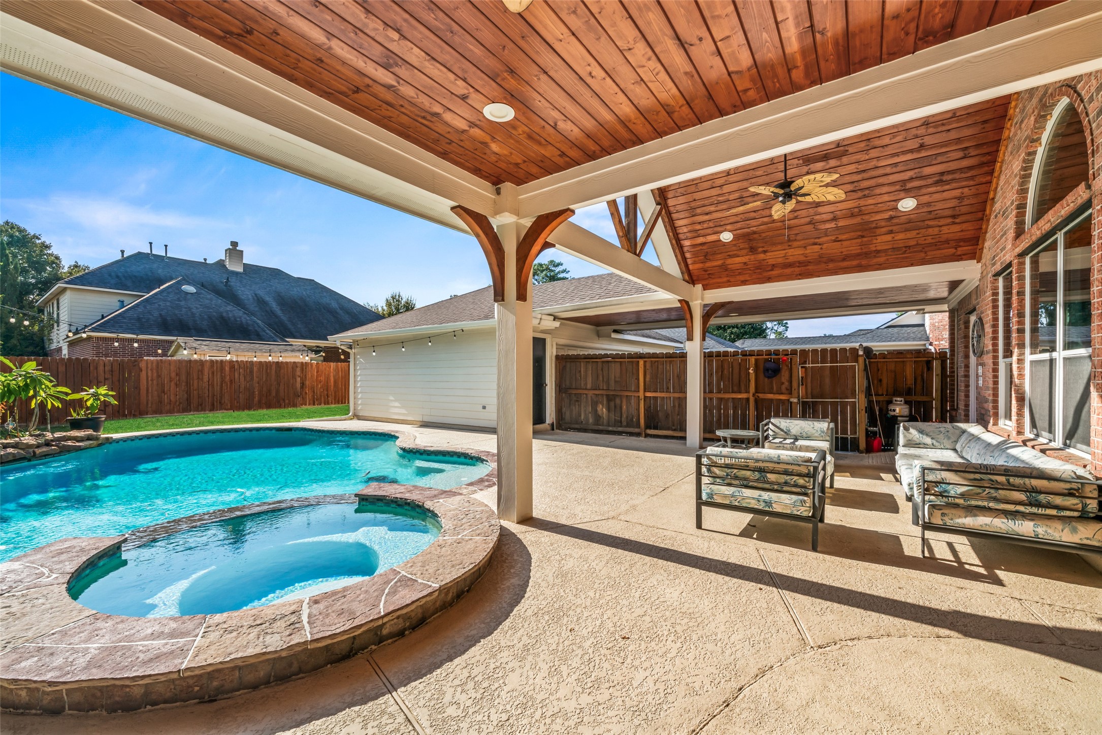 Relax in the spa or in the wood-paneled covered patio.