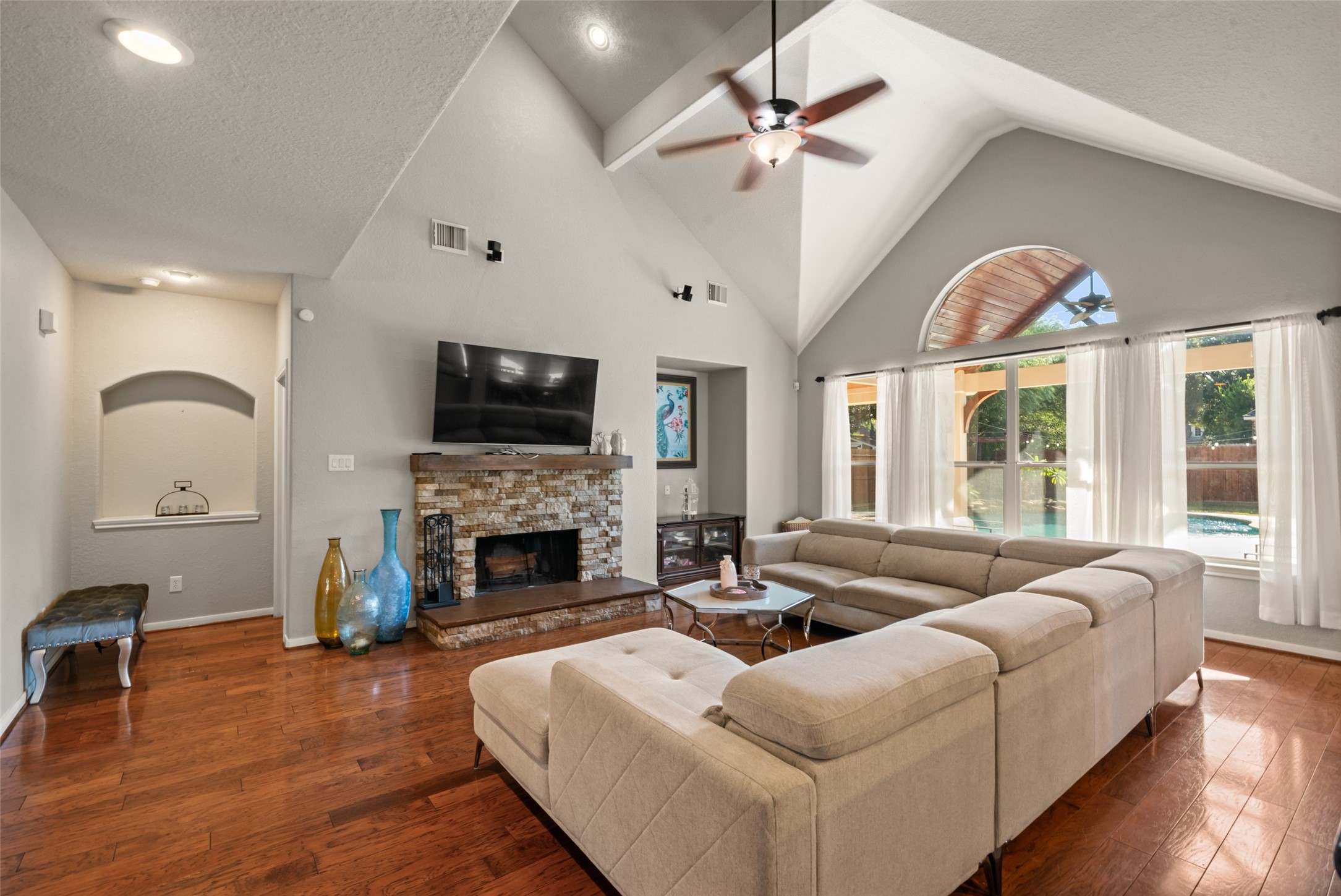 Gather around the fireplace beneath the beautiful soaring ceilings.