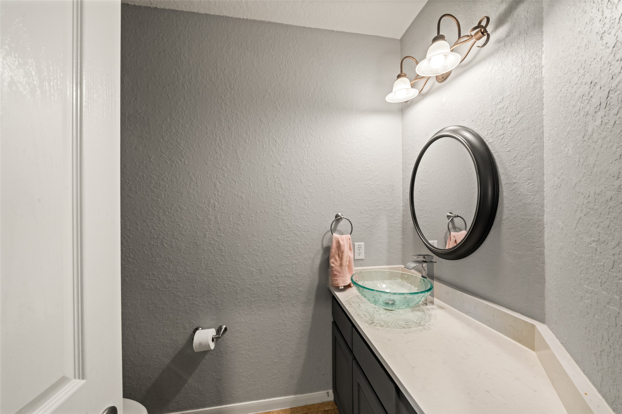 A convenient half bath downstairs for guests.