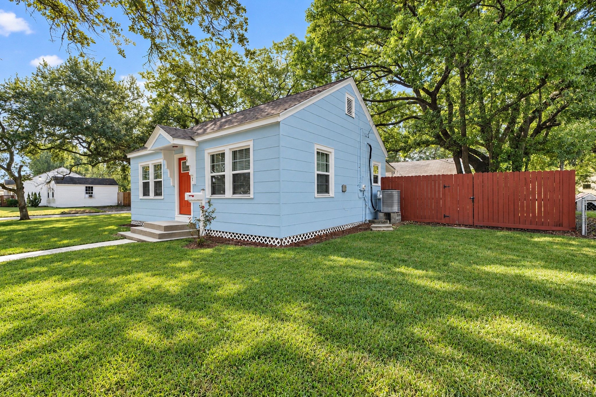 A charming home with room to enjoy the outdoors! The surrounding lawn offers breathing room, while the home's classic design makes it an appealing option for buyers seeking simplicity and character.