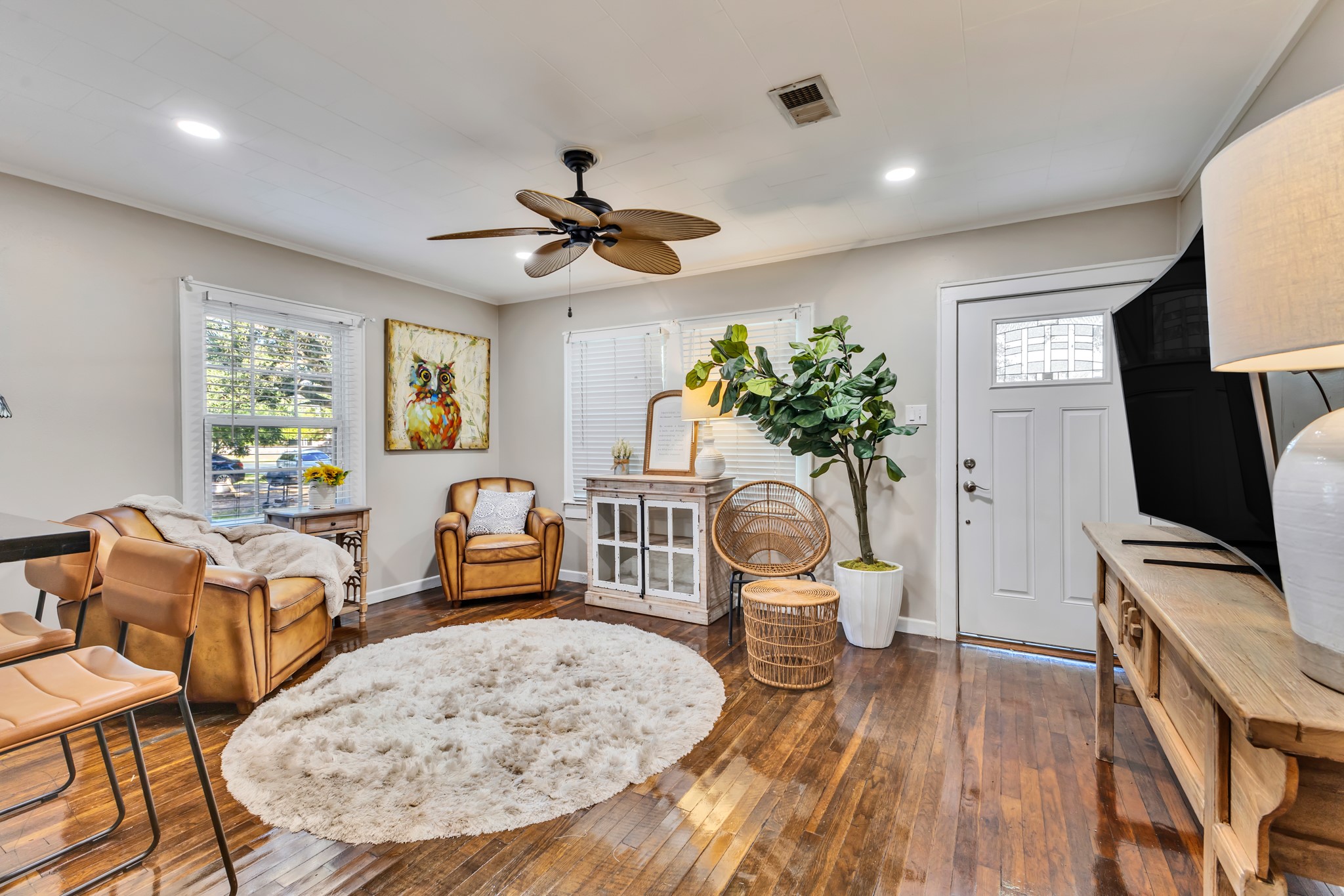 The inviting living room offers the perfect balance of comfort and functionality. With natural light and a layout that connects to the kitchen, this space makes everyday living easy and enjoyable.