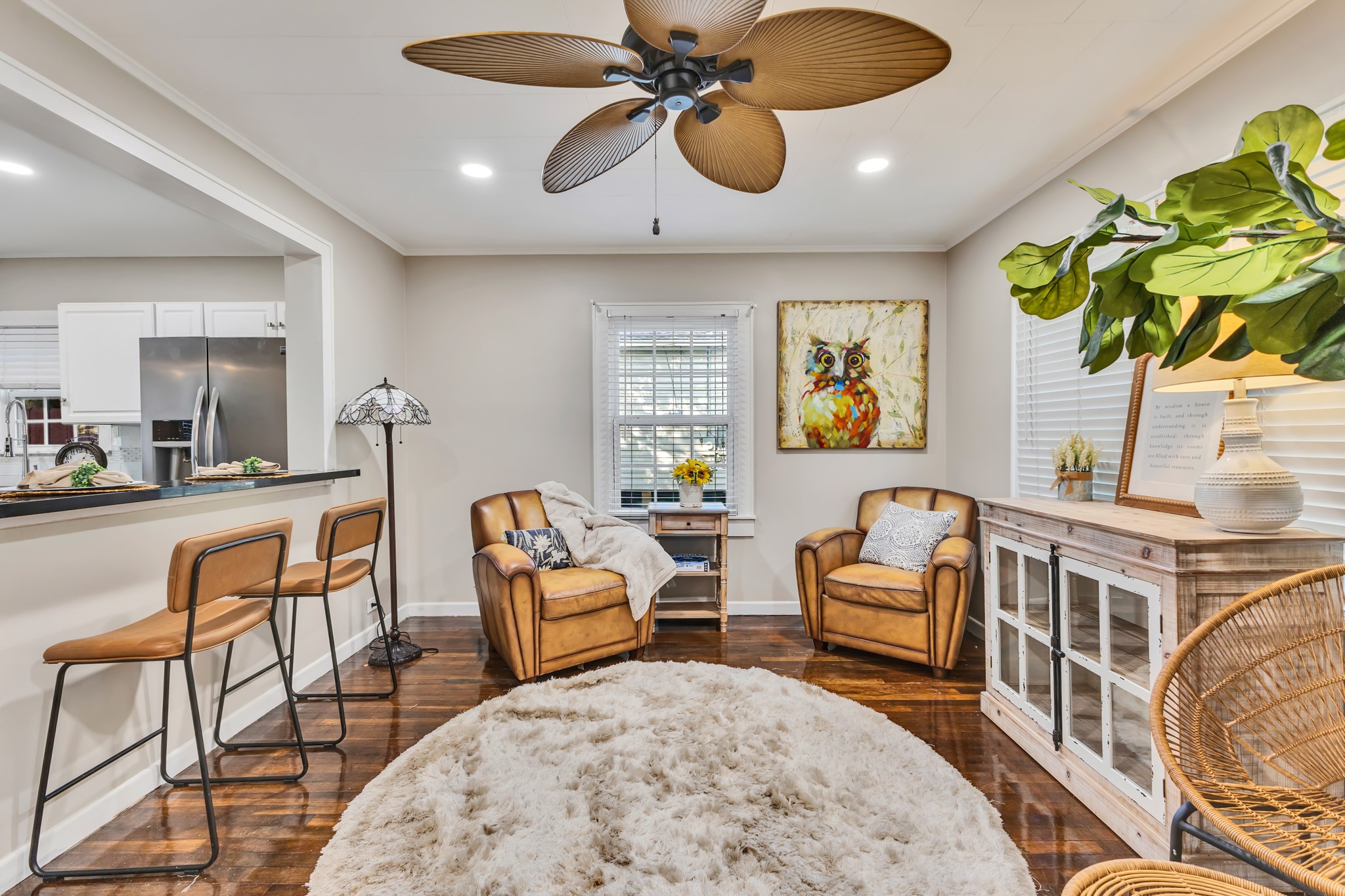 Comfortable living starts with a space that feels welcoming! Natural light, warm flooring, and an open connection to the kitchen make this room ideal for relaxing, entertaining, or spending quality time together.
