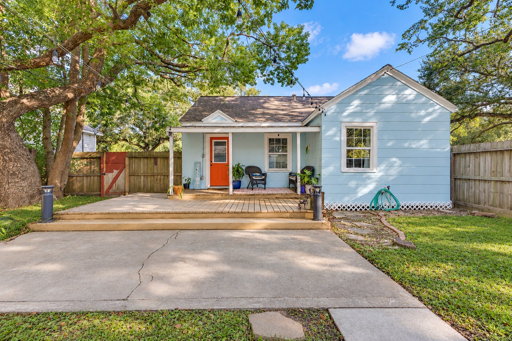 Outdoor space is a standout feature of this charming home! The covered porch, paved area, and fenced backyard offer flexibility for entertaining, outdoor furniture, and enjoying time outside.