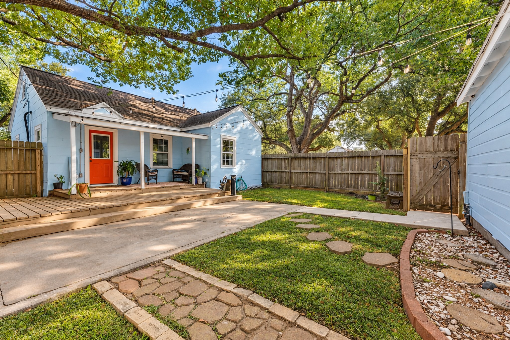 Enjoy room to spread out and make the most of outdoor living! The combination of lawn, mature trees, and paved space creates opportunities for gardening, outdoor gatherings, or simply relaxing in your own backyard.