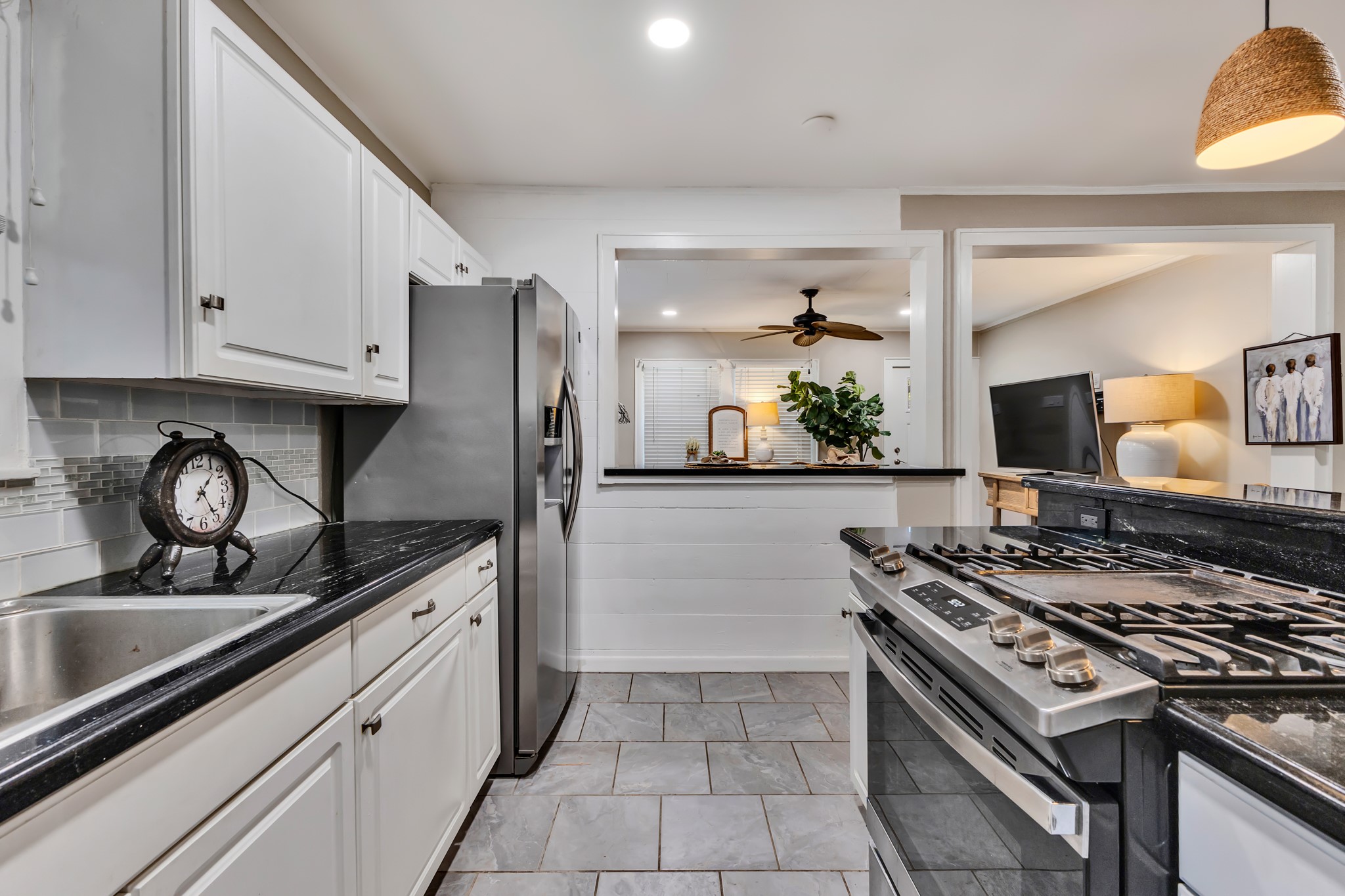 The kitchen opens toward the living room, creating a connected layout that makes the home feel welcoming. This thoughtful use of space allows you to enjoy comfortable everyday living without unnecessary separation.