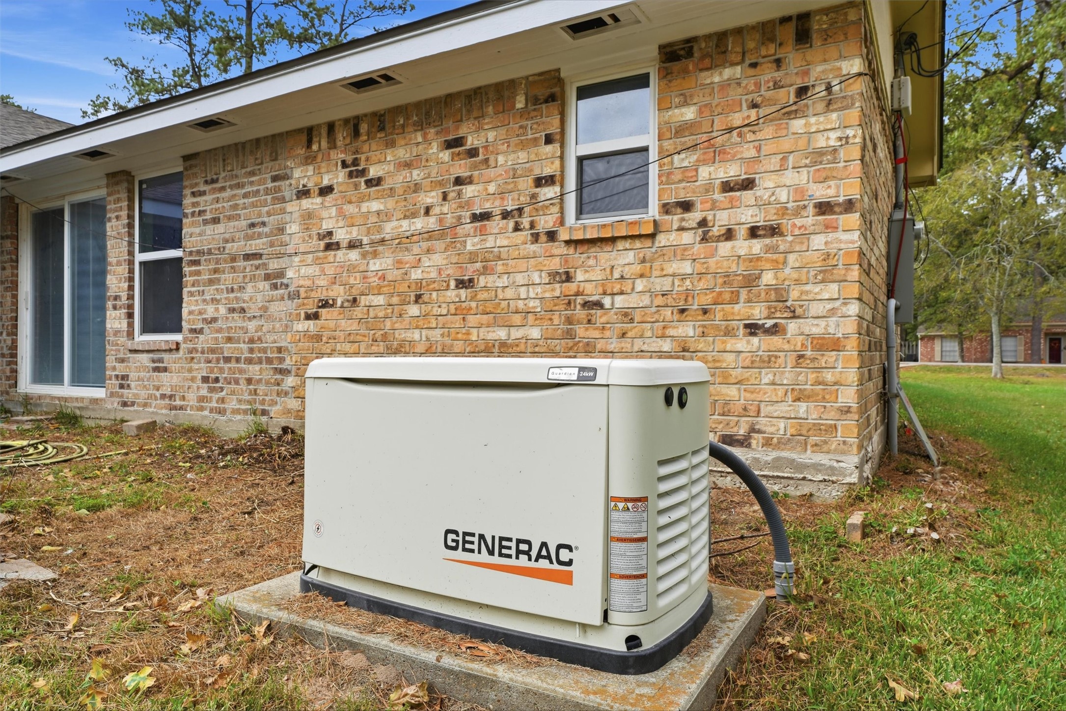 The home is equipped with a Generac whole-home standby generator, providing backup power during outages and added peace of mind during unexpected weather events.