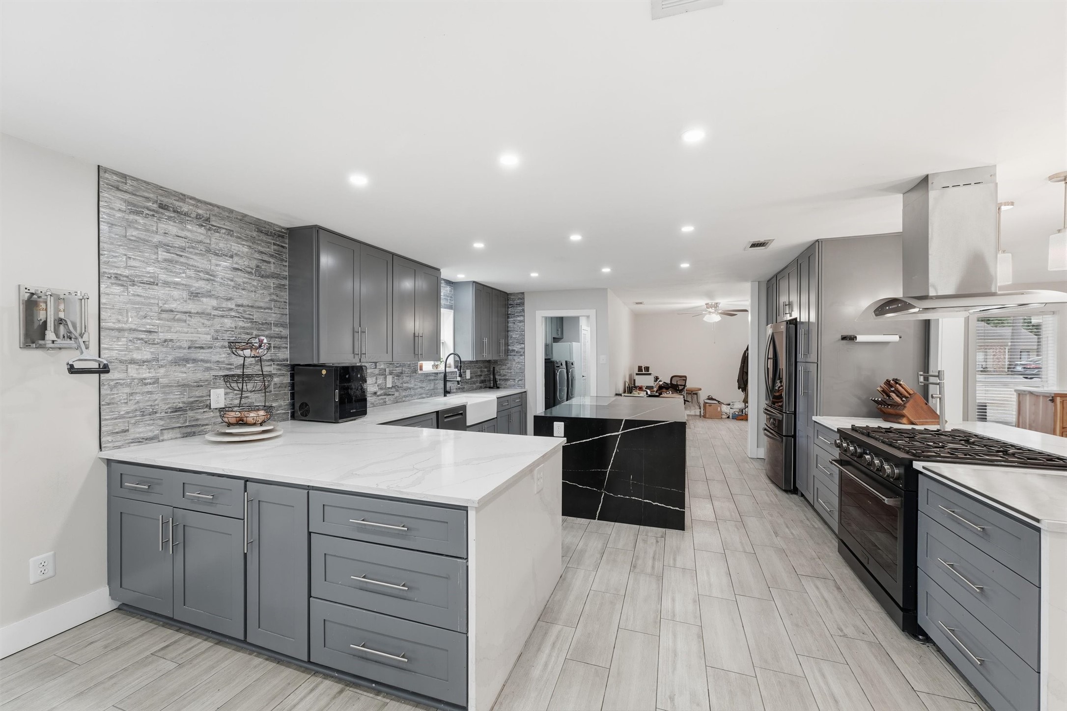 View from the dining/breakfast area showing plenty of counter space, abundant cabinet storage, and a convenient layout for cooking and meal preparation.
