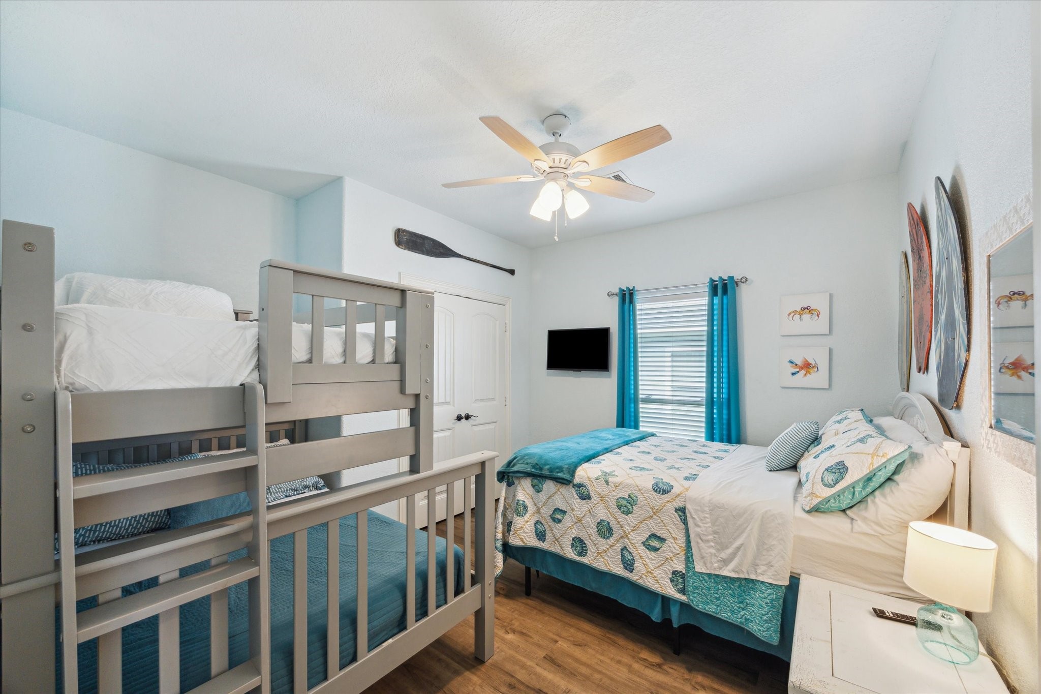 Large guest room perfect for hosting visitors or as "the kids' room!" This spacious area easily accommodates a queen-size bed and large bunk beds, making it ideal for family or friends.