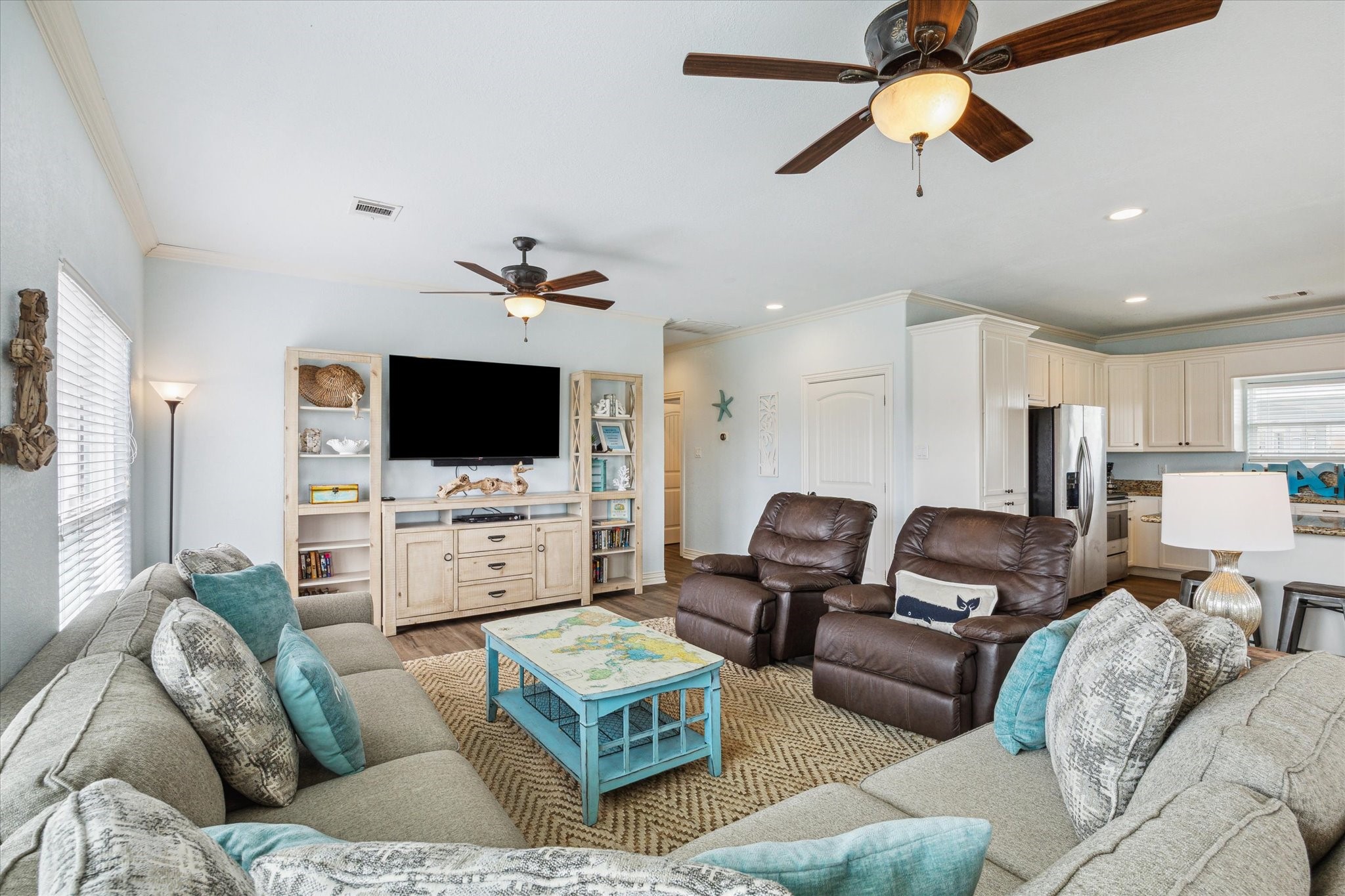 The family room is conveniently located off the kitchen, creating an open and inviting space for easy conversation and relaxation while you cook or entertain.