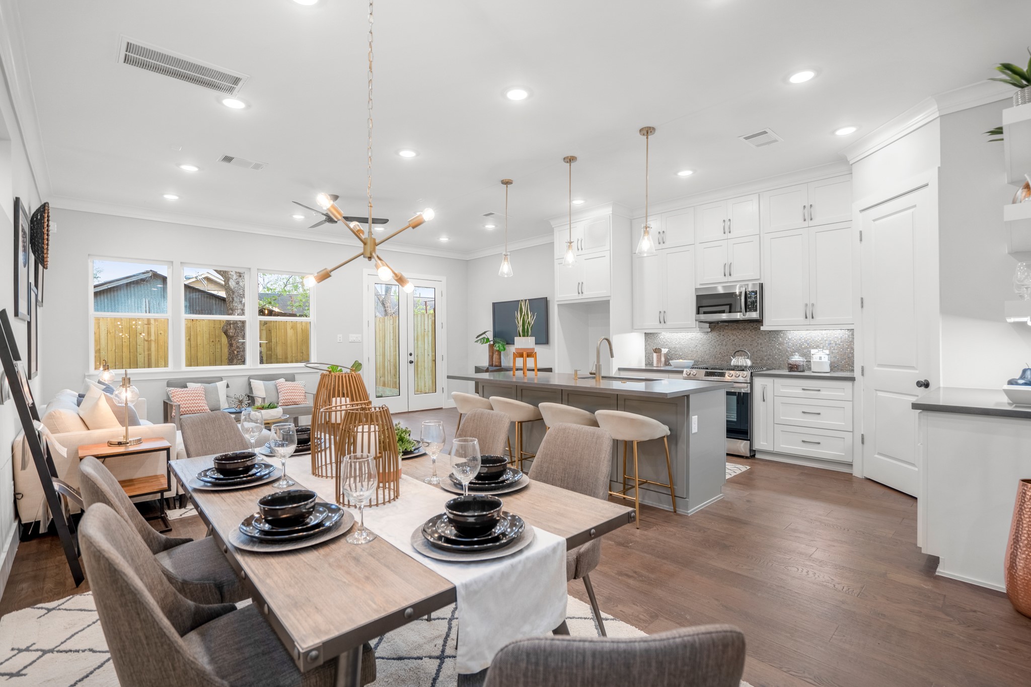 Another view of the spacious first floor living area overlooking french doors that open to a private backyard. Photos are of previous model home. Another view of the spacious first floor living area overlooking french doors that open to a private backyard. Photos are of previous model home.
