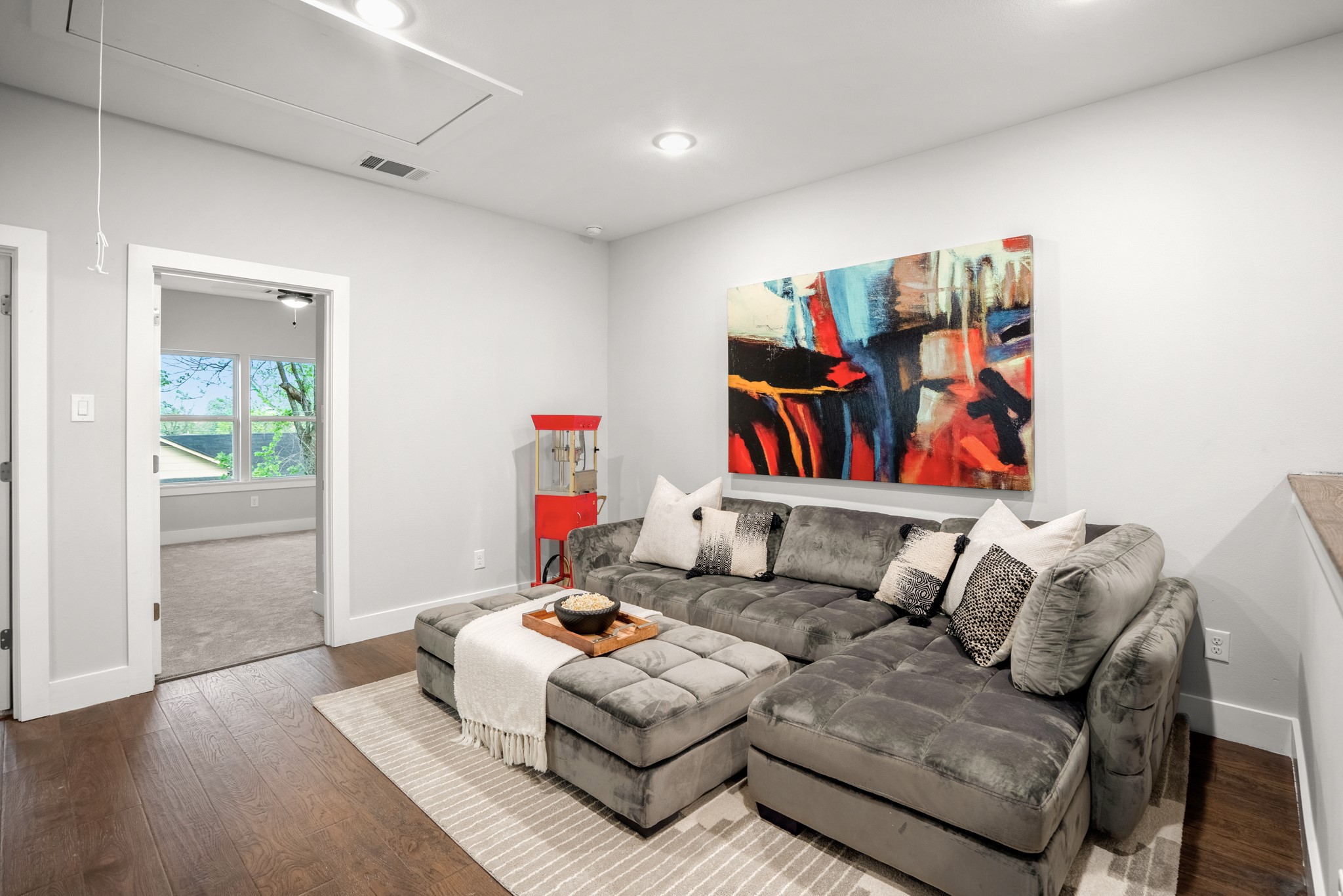 The flex space or secondary living room offers versatile functionality, providing a cozy retreat for relaxation, entertainment, or even work. Photos are of previous model home.