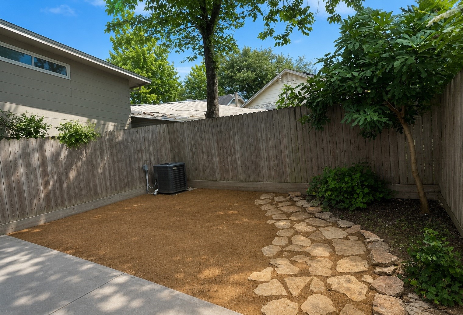 Outside, the generous backyard offers plenty of room for pets to roam and guests to gather.