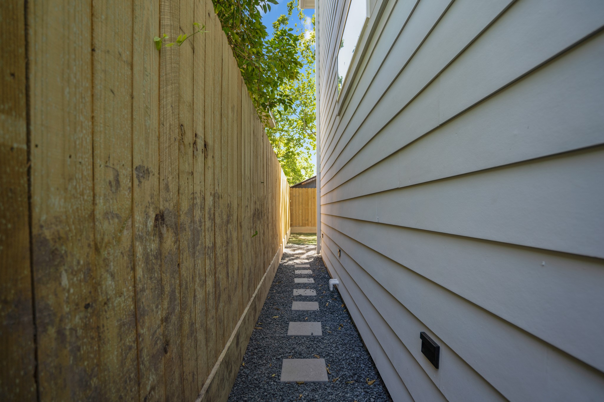 Whether it's accessing the backyard, garage, or front entrance, this well-defined pathway ensures safe and efficient navigation around the home. Photos are of previous model home.