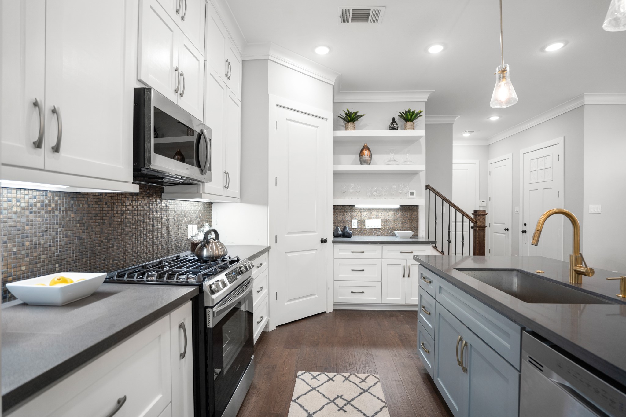 The heart of the home boasts a gourmet kitchen, complete with a deep farmhouse stainless steel sink and a sleek stainless steel appliance package. Photos are of previous model home. The heart of the home boasts a gourmet kitchen, complete with a deep farmhouse stainless steel sink and a sleek stainless steel appliance package. Photos are of previous model home.