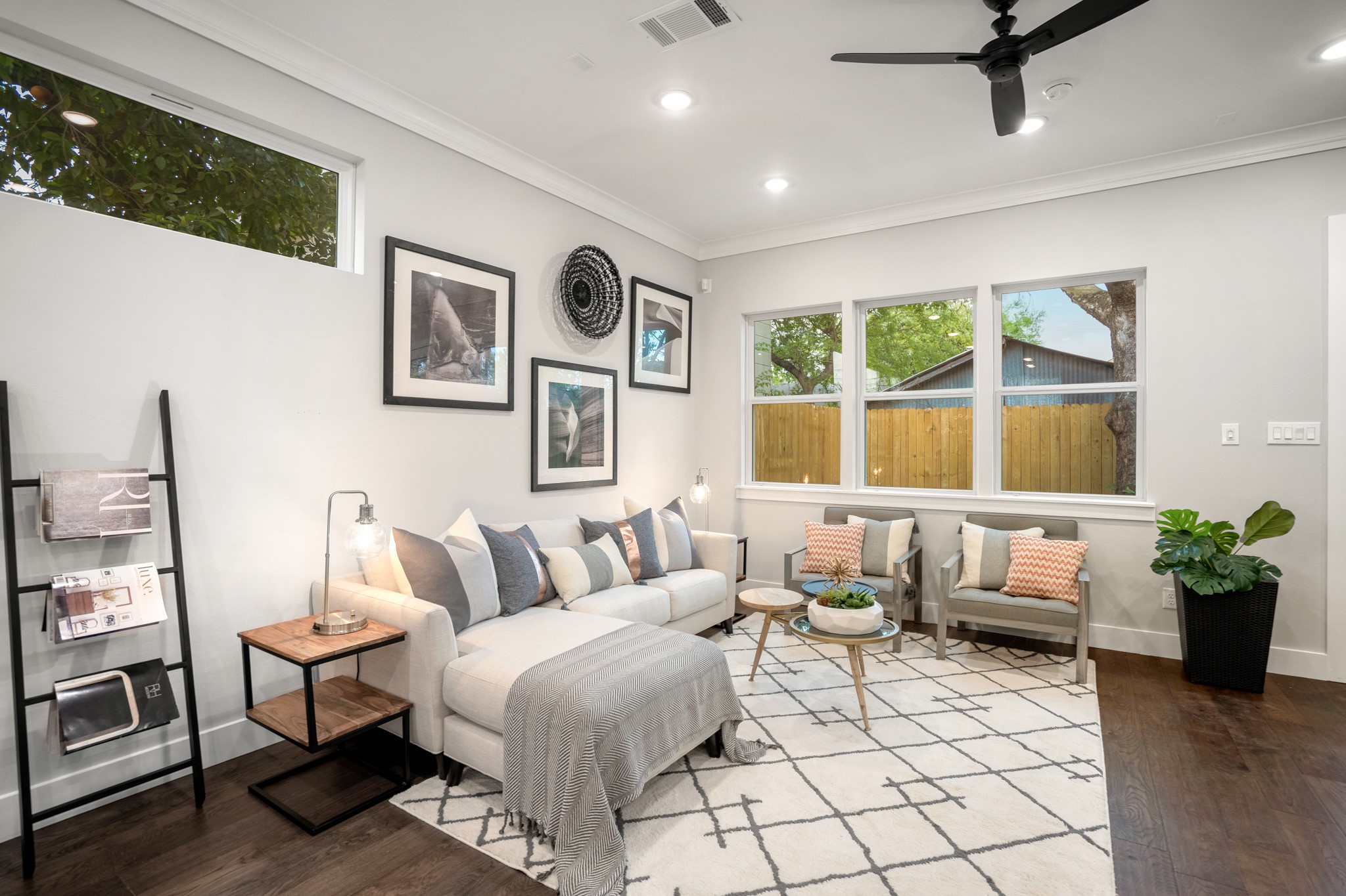 Large windows with energy-efficient LOW E coating provide ample natural light, enhancing the ambiance. Photos are of previous model home.