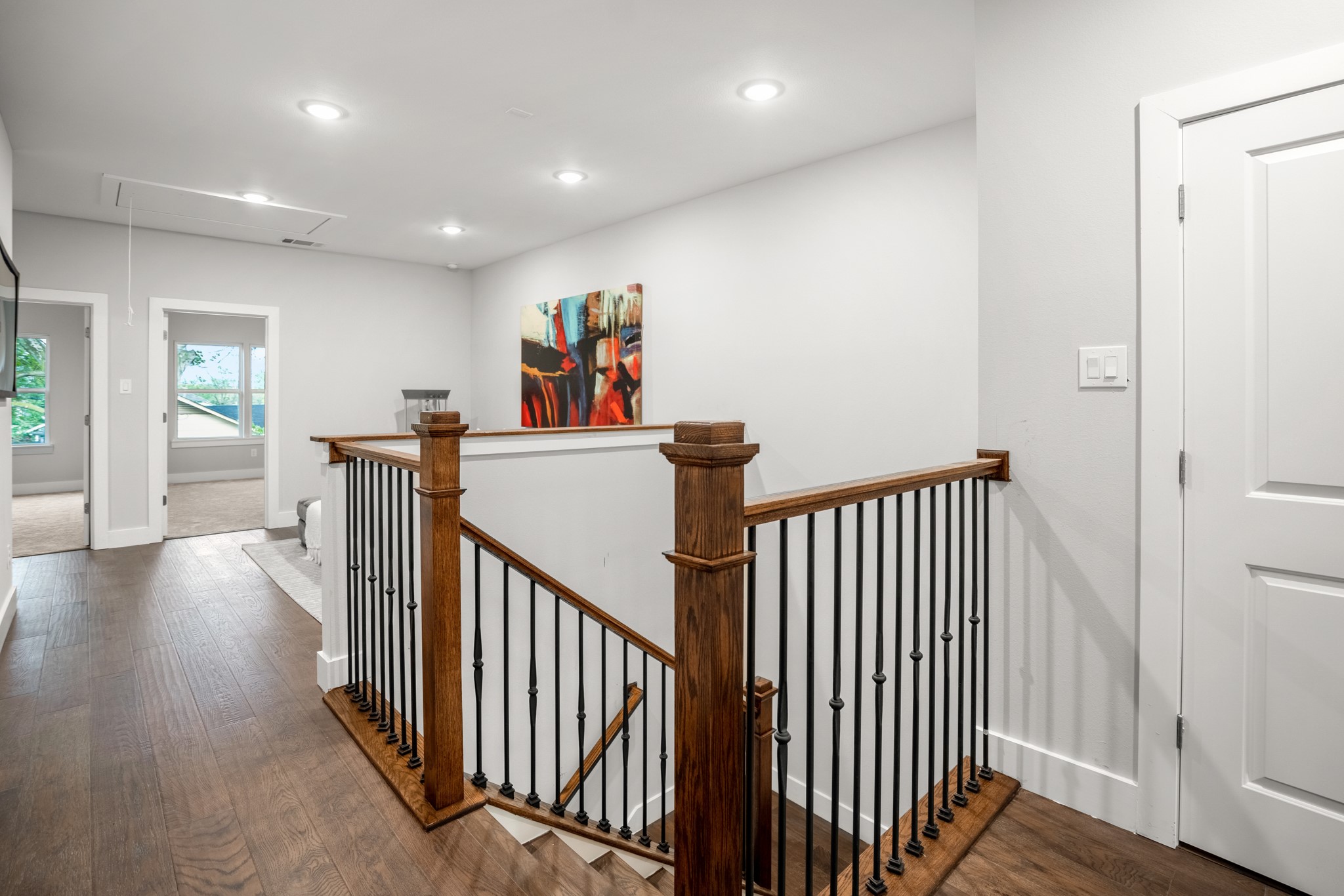 the stairwell invites you to ascend to the upper levels with a sense of elegance and grace. Photos are of previous model home.