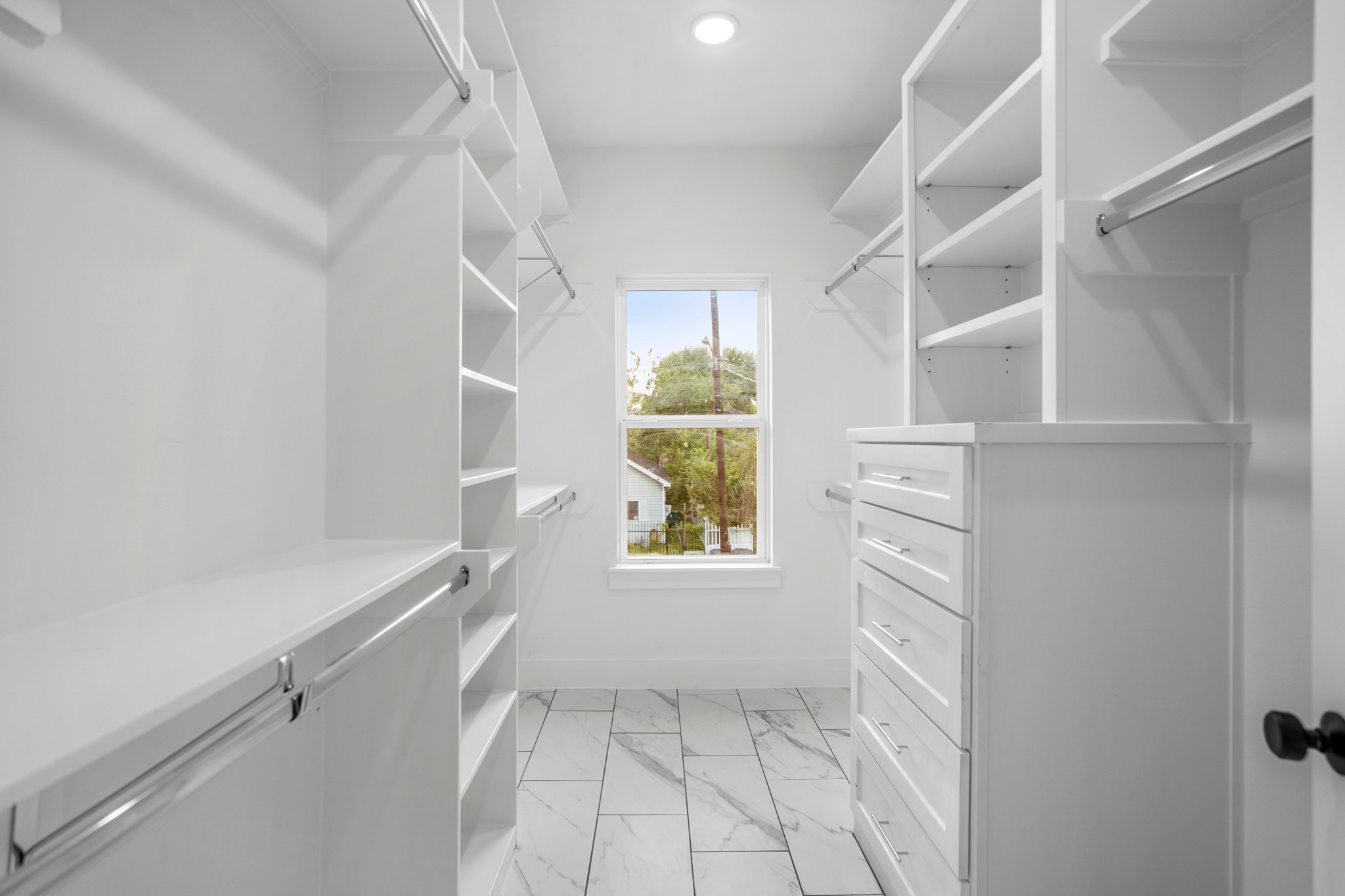 Adjacent to the master bathroom, a spacious walk-in closet provides ample storage space for all your wardrobe essentials. Photos are of previous model home.