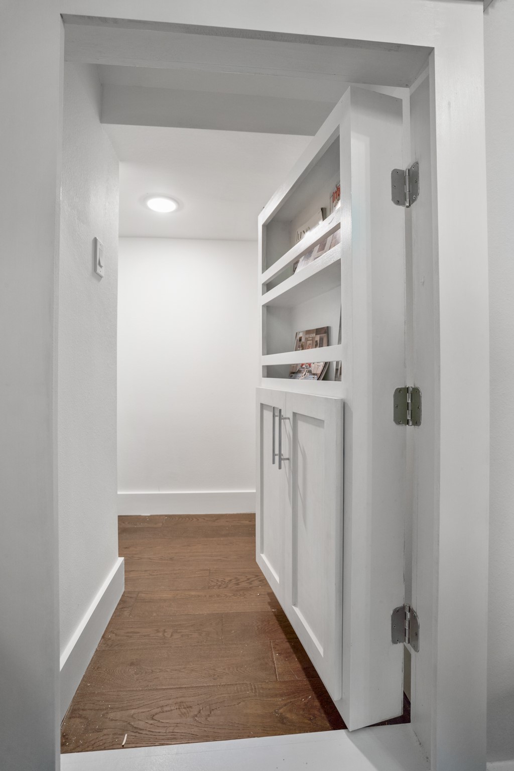 With its seamless integration into the design, this concealed storage adds both functionality and elegance to the powder room. Photos are of previous model home.