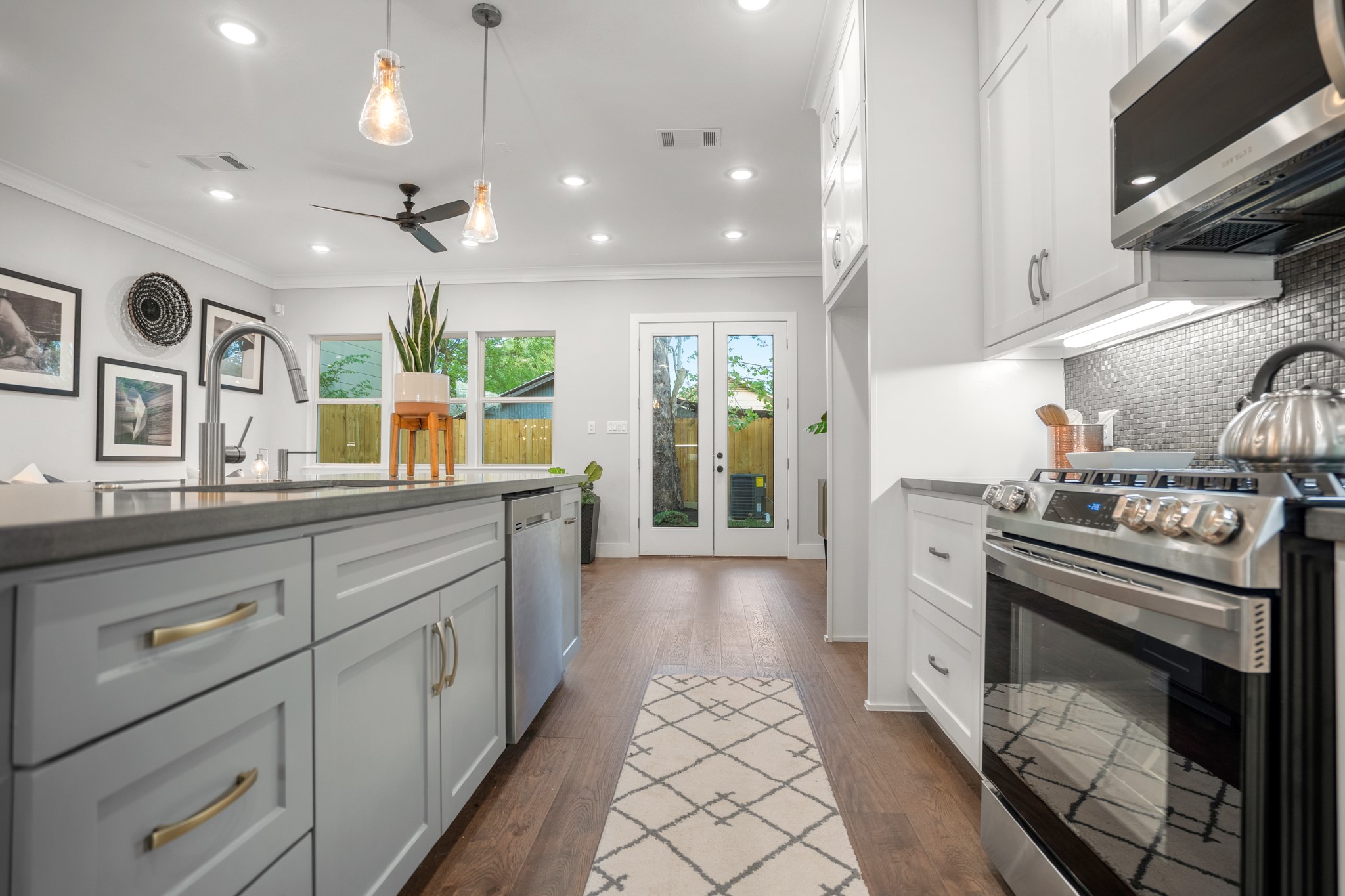 Natural light floods the space, highlighting the exquisite craftsmanship of the cabinetry. Photos are of previous model home.
