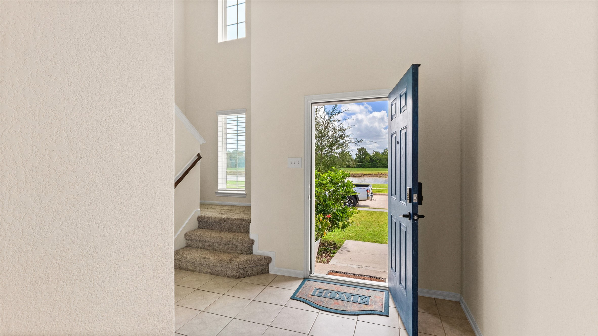 Turning around to see the front door and stairs.