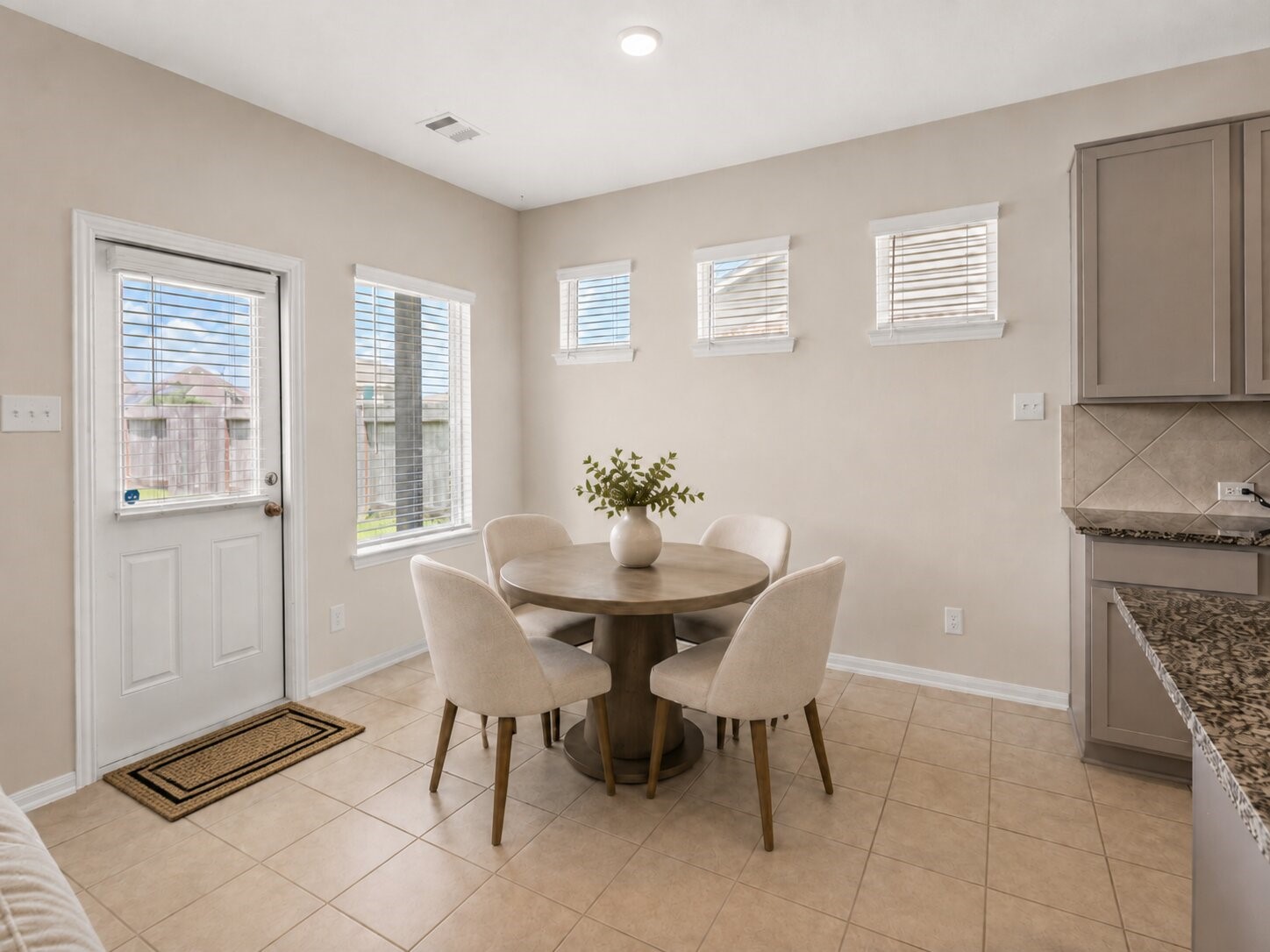 *virtually staged* The breakfast area provides a comfortable spot for everyday meals with views of the backyard.