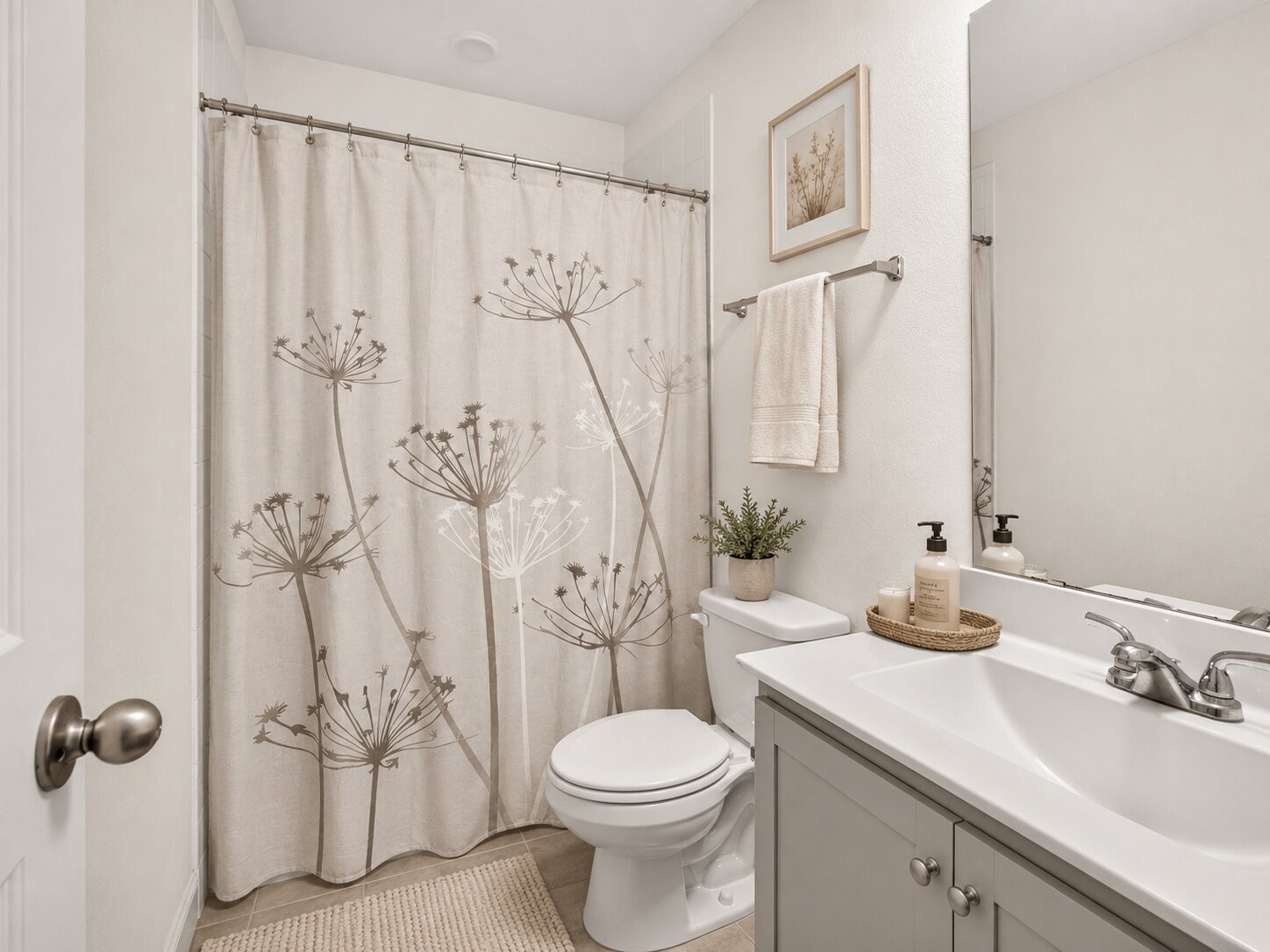 *virtually staged* The upstairs guest bathroom serves the secondary bedrooms and includes a tub and shower combination.