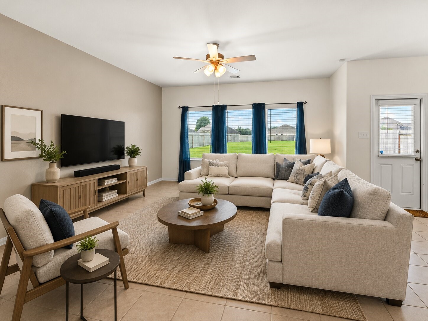 *virtually staged & painted* The spacious living room offers plenty of room for comfortable seating and entertaining.