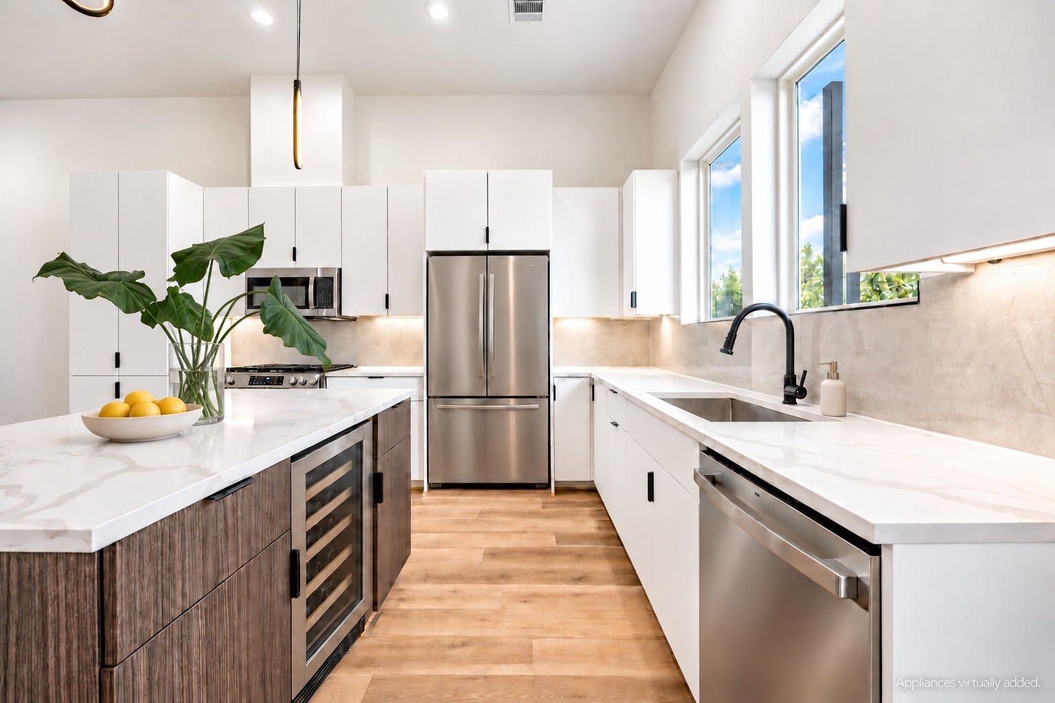 Kitchen with gas cooking, ample cabinet storage, under-cabinet lighting and an island with seating. *Refrigerator and wine cooler virtually added.