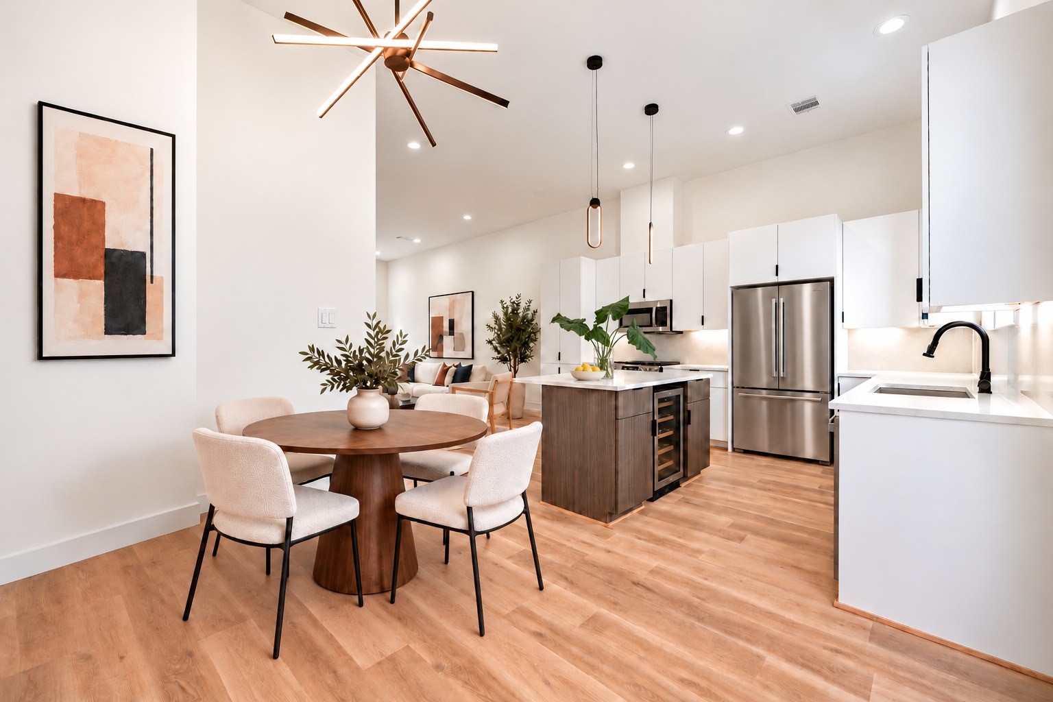 Bright dining area beside the island kitchen, with direct access to the private balcony. *Furniture, refrigerator and wine cooler virtually added.