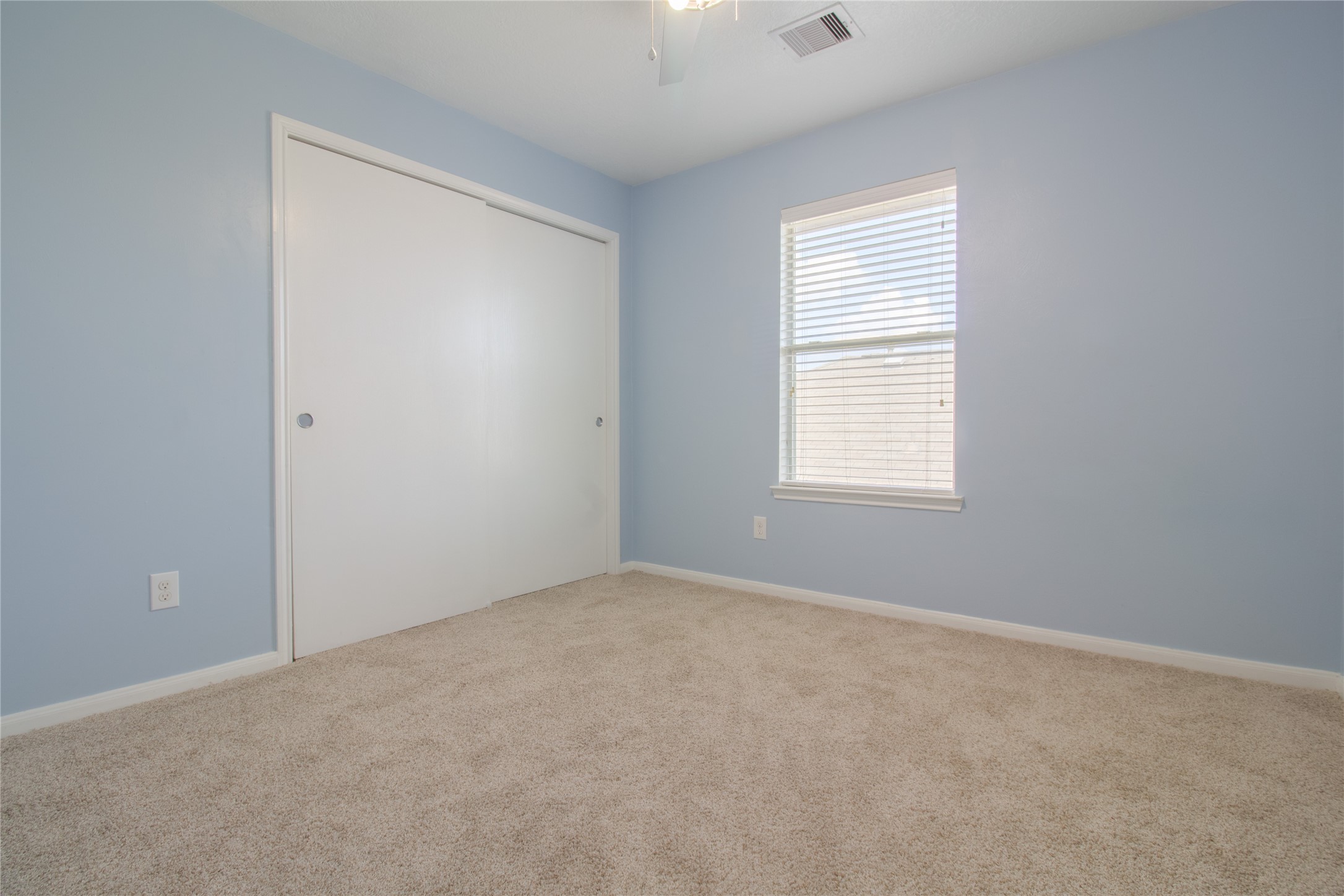Bedroom 2 is conveniently located on the left side of the hallway and features brand-new carpet.