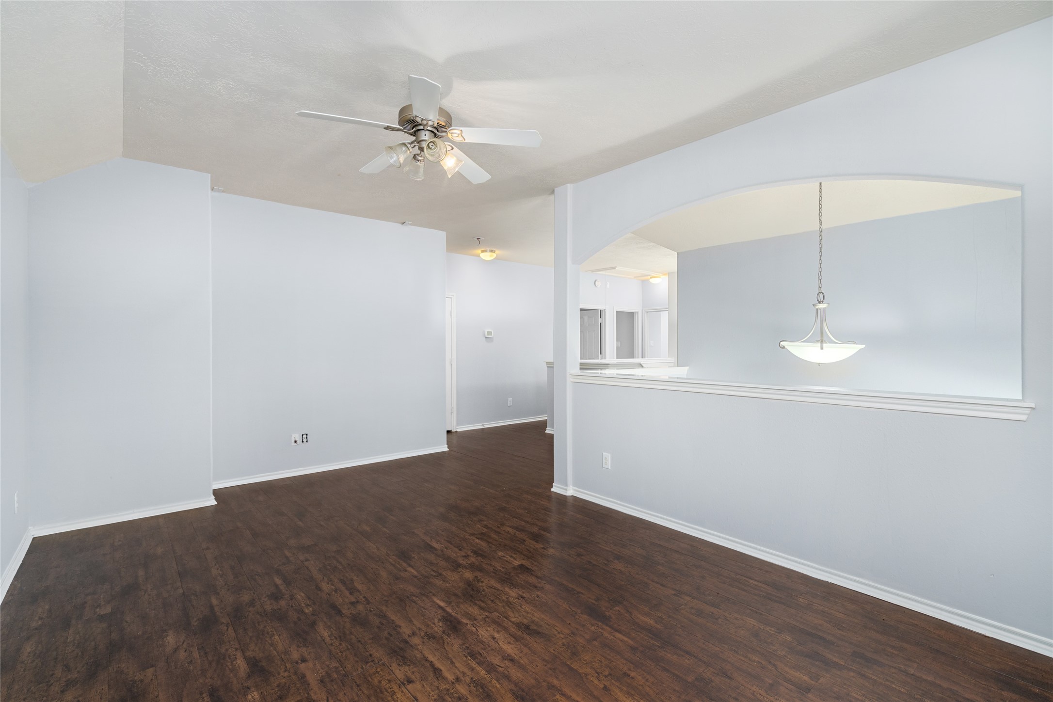 Alternate view of the game room showing its open floor area and connection to the adjacent upper-level spaces. The room's flexible footprint allows buyers to adapt it to changing needs, from play space to entertainment or study area.