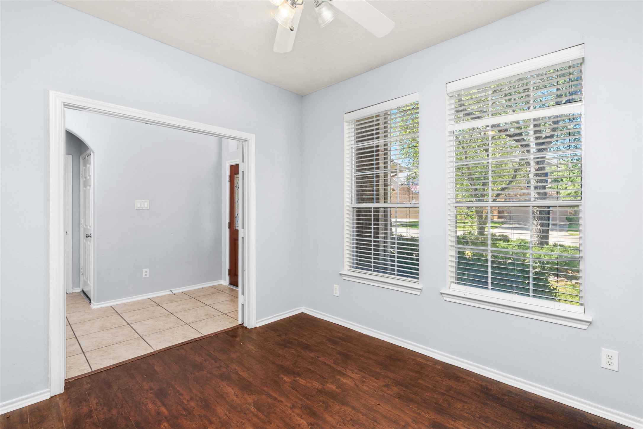 Bright and inviting, the home office seamlessly connects to the hallway and front door, offering a perfect blend of productivity and welcoming charm.